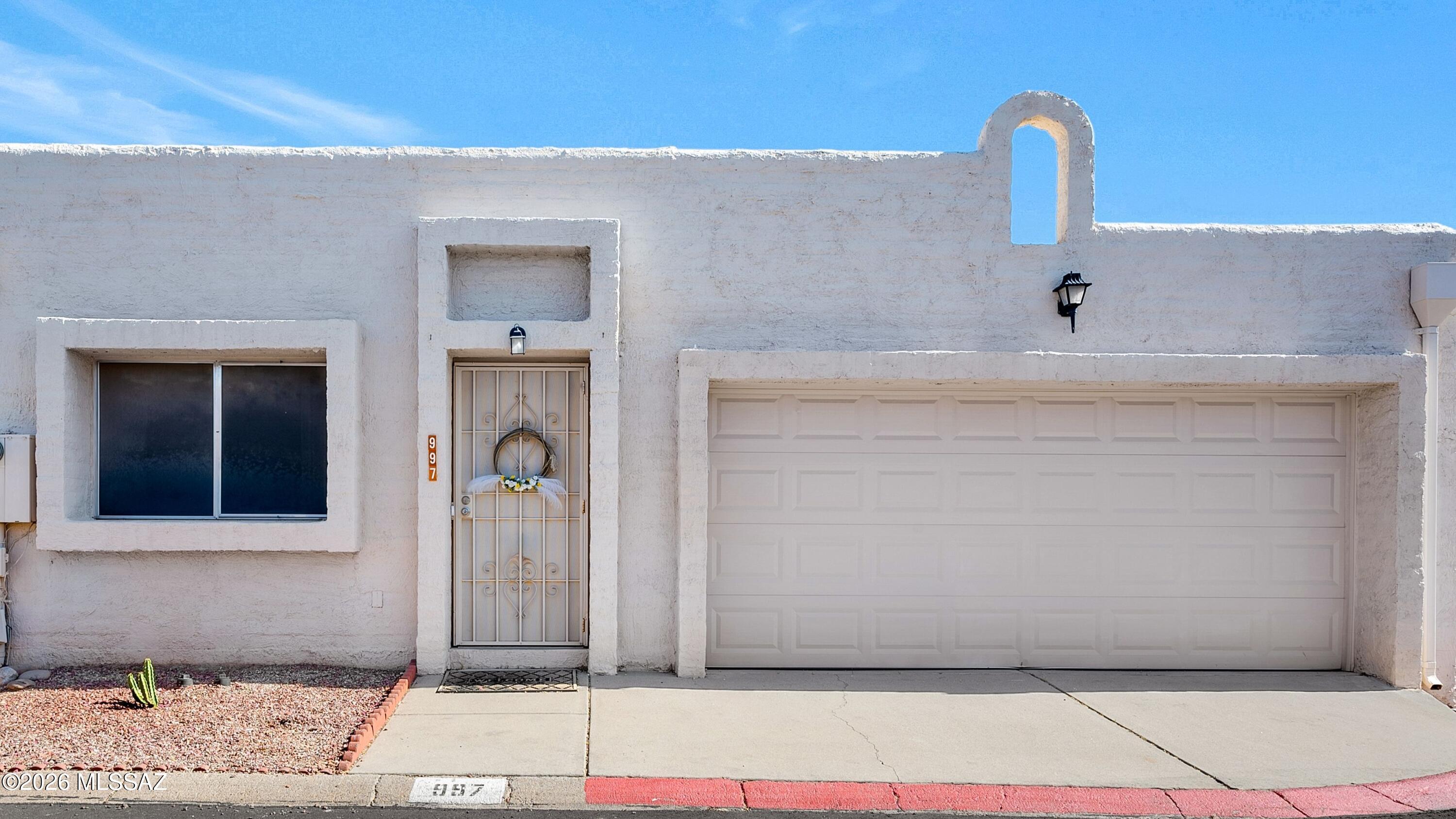 Beautifully updated, immaculately maintained, and truly move-in ready, this exceptional single-level townhome in Pueblo Villas West offers the perfect blend of comfort, style, and effortless living. Featuring 2 spacious bedrooms, 2 full bathrooms, and approximately 1,232 square feet, this thoughtfully designed residence delivers both functionality and modern appeal in a highly desirable setting. From the moment you step inside, you're greeted by soaring ceilings, multiple skylights, and an abundance of natural light that fills the home with warmth and openness. The interior has been tastefully upgraded with ceramic tile flooring throughout--yes, absolutely no carpet--creating a clean, cohesive look that is both elegant and incredibly easy to maintain. The beautifully updated kitchen serves as the heart of the home, showcasing sleek quartz countertops, a blend of stainless steel and black appliances, ample cabinetry, and a layout that seamlessly opens to the main living and dining areas. Whether you're entertaining guests or enjoying a quiet evening in, this open-concept design offers both comfort and versatility. Both bedrooms are generously sized, offering flexibility for guests, a home office, or full-time living. The primary suite is a true retreat, featuring an updated vanity area, a spacious walk-in closet, and a well-appointed en suite bathroom. The second bedroom and full bath provide additional comfort and convenience for visitors or extended stays. This corner-unit townhome enhances privacy while offering a peaceful outdoor experience. Step outside to your covered patio with an extended awning--perfect for relaxing mornings or enjoying Arizona's beautiful evenings. Thoughtful upgrades such as retractable window shades help keep the home cool and comfortable during the warmer months. Adding even more value, the refrigerator, washer, and dryer are all included, making this a true turnkey opportunity ready for immediate enjoyment. Whether you're seeking a full-time residence, a low-maintenance winter retreat, or a lock-and-leave lifestyle, this home checks every box. Ideally located near shopping, dining, and everyday conveniences, with easy access to Tucson's desirable foothills, this property offers both convenience and tranquility in one exceptional package. Homes of this quality and condition do not last--schedule your private showing today and experience everything this beautifully maintained townhome has to offer.