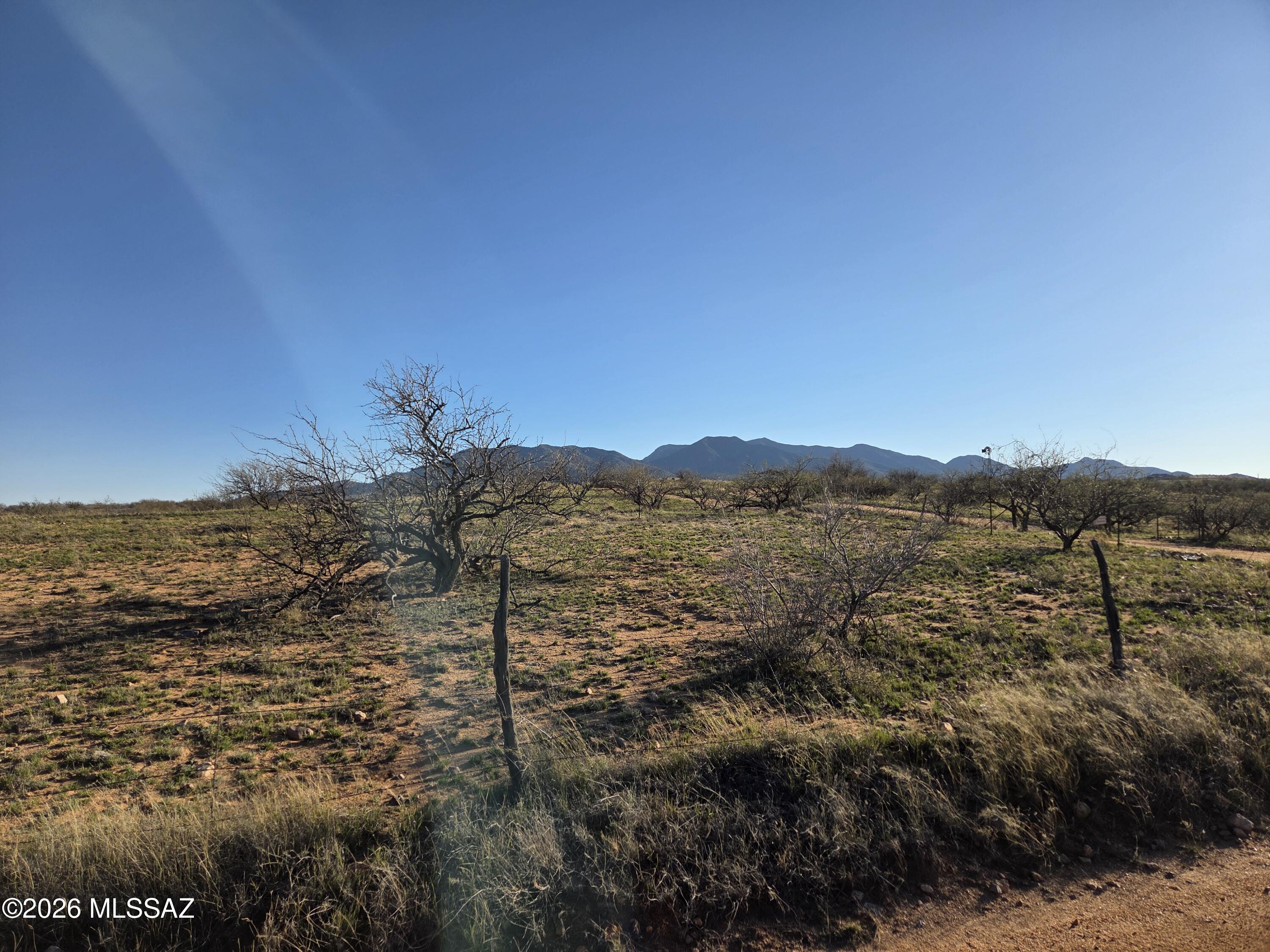 This property has expansive panoramic views of the Whetstone and Rincon Mountains, characterized by natural desert landscapes, rolling topography, and quiet, rural surroundings.  Enjoy scenic sunrises and sunsets with the only sounds those of native desert creatures.  The rolling landscape allows owners to select a low or high point for views and privacy.  The RU-4 zoning is popular for homesteading, allowing for private wells, septic systems, unconventional, owner-built housing via the Owner-Builder Opt-Out permit.  Don't miss this Treasure in the Desert that sits near Benson, Sierra Vista, and Tucson with easy access to the Interstate I-10.