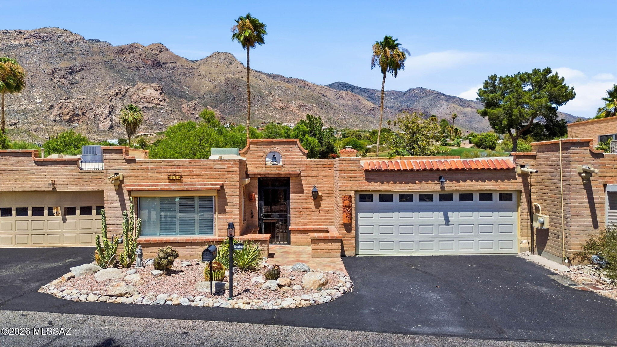 Seize the chance to own this charming adobe townhome beneath the picturesque Catalina Foothills.  Enjoy bold mountain views each morning & evening from back patio. Fall in love with the spacious great room, boasting skylights for abundant natural light, a soothing palette, a wet bar for entertaining, a harmonious blend of soft carpeting and tile flooring, and a cozy fireplace. The well-appointed kitchen comes with quartz counters, crisp white cabinetry, a tile backsplash, and sleek stainless steel appliances. The cozy main bedroom includes a private bathroom with double sinks for an efficient daily routine. Unwind at the end of a long day in the lovely backyard, featuring an open patio, well-laid pavers, and breathtaking mountain views for a picturesque backdrop. 3rd bedroom & bathroom has its own separate entry from inside and outside.  Be sure to enjoy all the community activities this neighborhood has to offer.  Located in the award winning Catalina Foothills School district.   Close to shopping and all the conveniences.