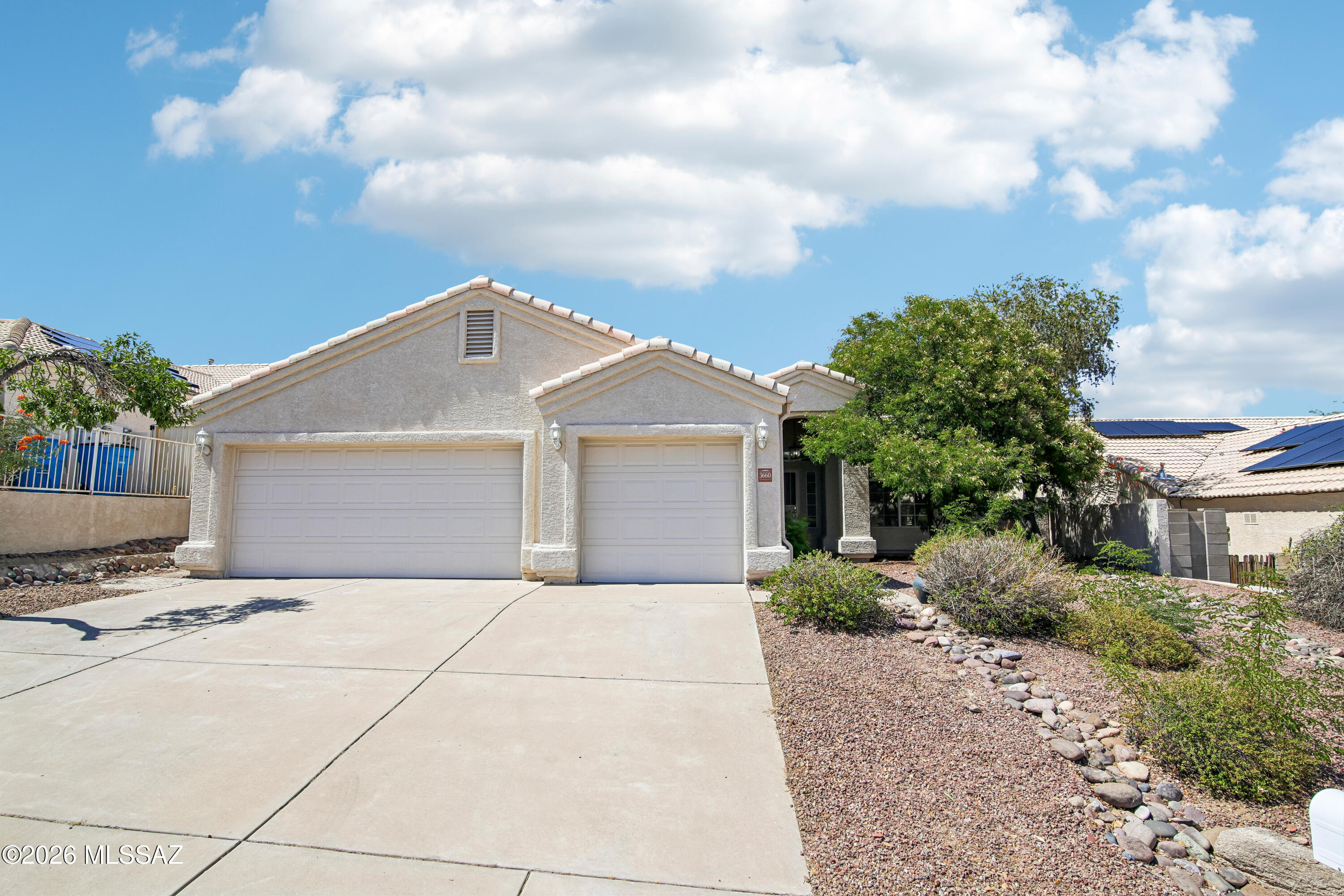 Situated on a peaceful cul-de-sac in Northwest Tucson, this stunning single-story home offers 4 bedrooms, 2 bathrooms, and 2,021 sq ft. The fully-owned solar system, newer HVAC, and updated water heater mean low utility bills. The 3-car garage features two mini-splits, creating a climate-controlled space perfect for a workshop, gym, hobbies, or extra storage year-round. The remodeled primary bathroom features a dual vanity and oversized tiled shower. Minutes from Costco, Home Depot, Top Golf, dining, shopping, and I-10!