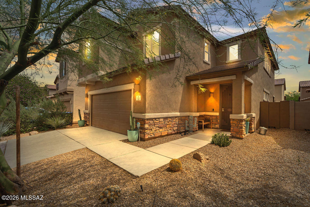 Bright, spacious, and beautifully maintained, this 2020 built home in Entrada La Villita offers 2,423 sq ft of comfortable living in one of Rancho Sahuarita's most convenient neighborhoods.
Step inside to tile flooring, an inviting great room, and an open concept layout that connects the kitchen, dining, and living areas. The kitchen features granite countertops, a large island, dual ovens, a gas range, and abundant cabinetry. A versatile downstairs den with built in shelving and a full bath provides ideal space for guests or a home office.
Upstairs, you'll find four spacious bedrooms, two full bathrooms, a conveniently located laundry room, and a large upstairs great room - perfect as a second living area, playroom, or media space. The primary suite includes dual sinks, granite counters walk in shower, and a walk in closet.
The backyard is designed for easy enjoyment with artificial turf, pavers, and low maintenance landscaping, creating a great space for relaxing or entertaining. Additional features include a whole house water filtration system and a calming interior color palette that enhances the home's peaceful feel.
With quick access to parks, schools, shopping, and Rancho Sahuarita's resort style amenities, this move in ready home blends modern style with everyday convenience.