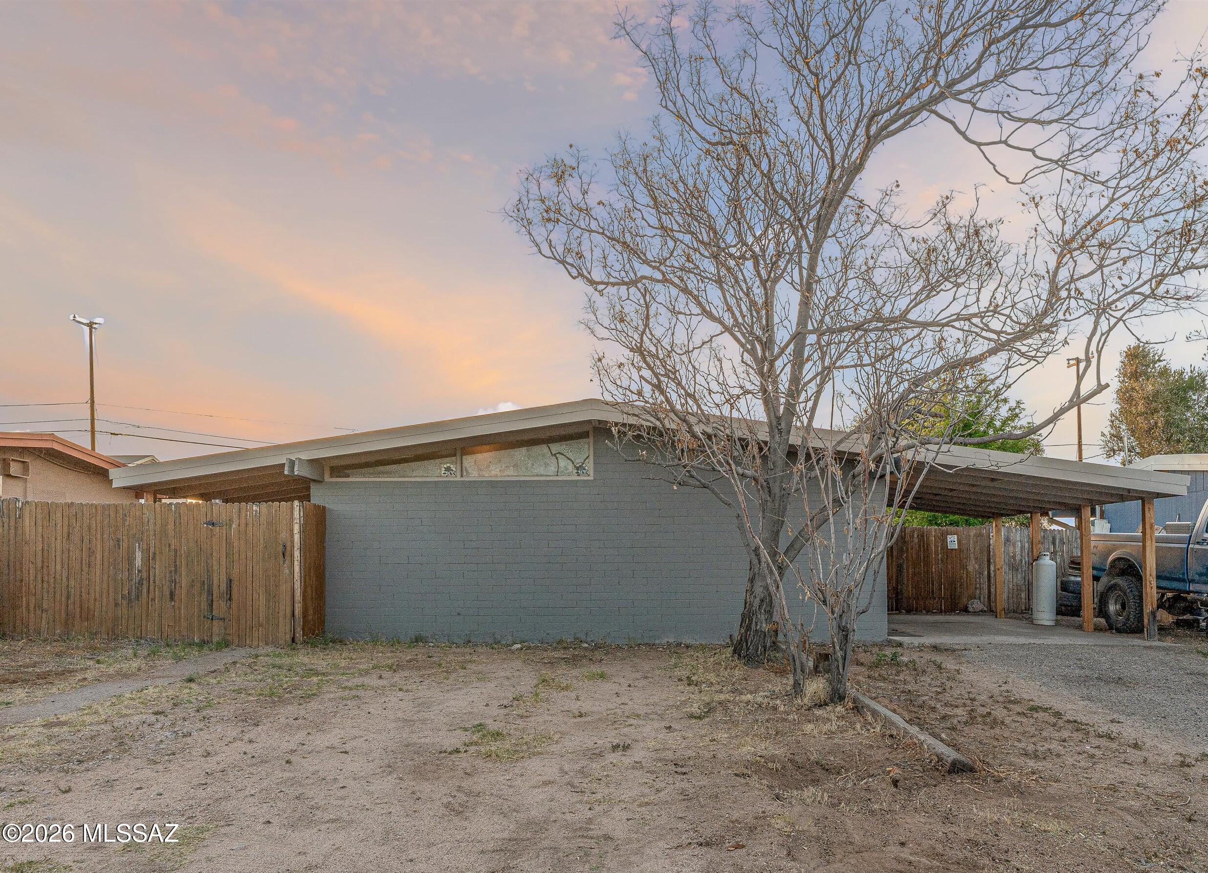 **Seller will give $5,000 credit towards new appliances!** This 2-bed, 1-bath home with a metal roof and central AC backs to the desert for privacy and sunset views! This property has been completely remodeled inside, with new flooring, new interior/exterior paint, new kitchen cabinets, and remodeled bathroom with new tile shower and vanity. Newly installed water heater, and recently installed air conditioning. The large backyard is fully-fenced, with a gate for alley access and no neighbors behind! Red car in front yard and boat/trailer in backyard will be removed prior to closing. No HOA!