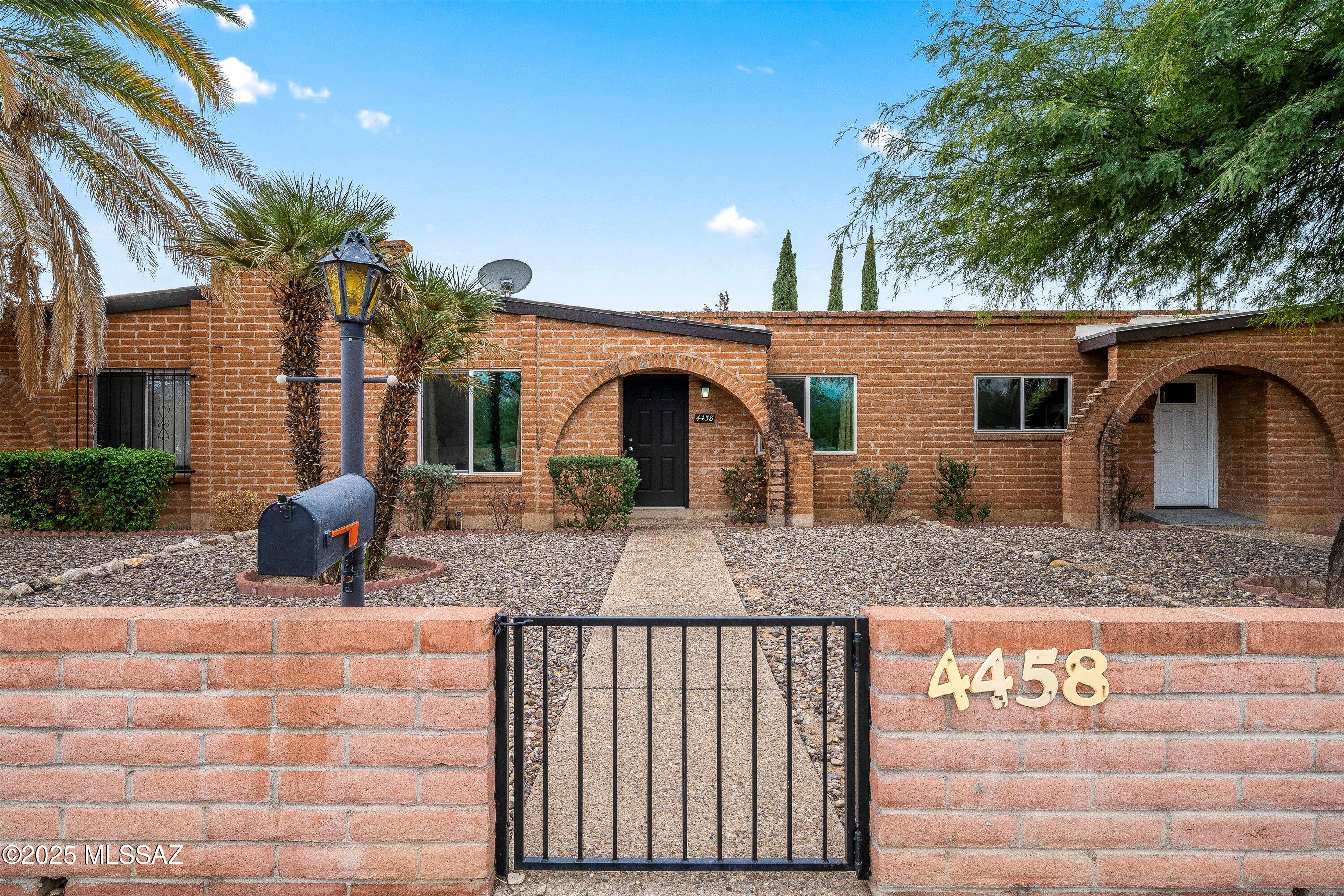 Beautifully maintained and move-in ready, this charming 2-bed, 2-bath townhome in sought-after Spanish Village offers comfort, convenience, and low-maintenance living. The thoughtfully designed single-level split floorplan features fresh new carpet, spacious open-concept living and dining areas, and abundant natural light throughout. The inviting primary suite includes a walk-in closet and beautifully updated shower. Unwind on the private covered patio, complete with a rear-entry carport and storage shed for extra functionality. Residents enjoy beautifully kept grounds, a sparkling community pool, and an unbeatable central location near the Rillito River Walk, McCormick Park, TMC, shopping, dining, and more. Motivated seller--don't miss this opportunity!