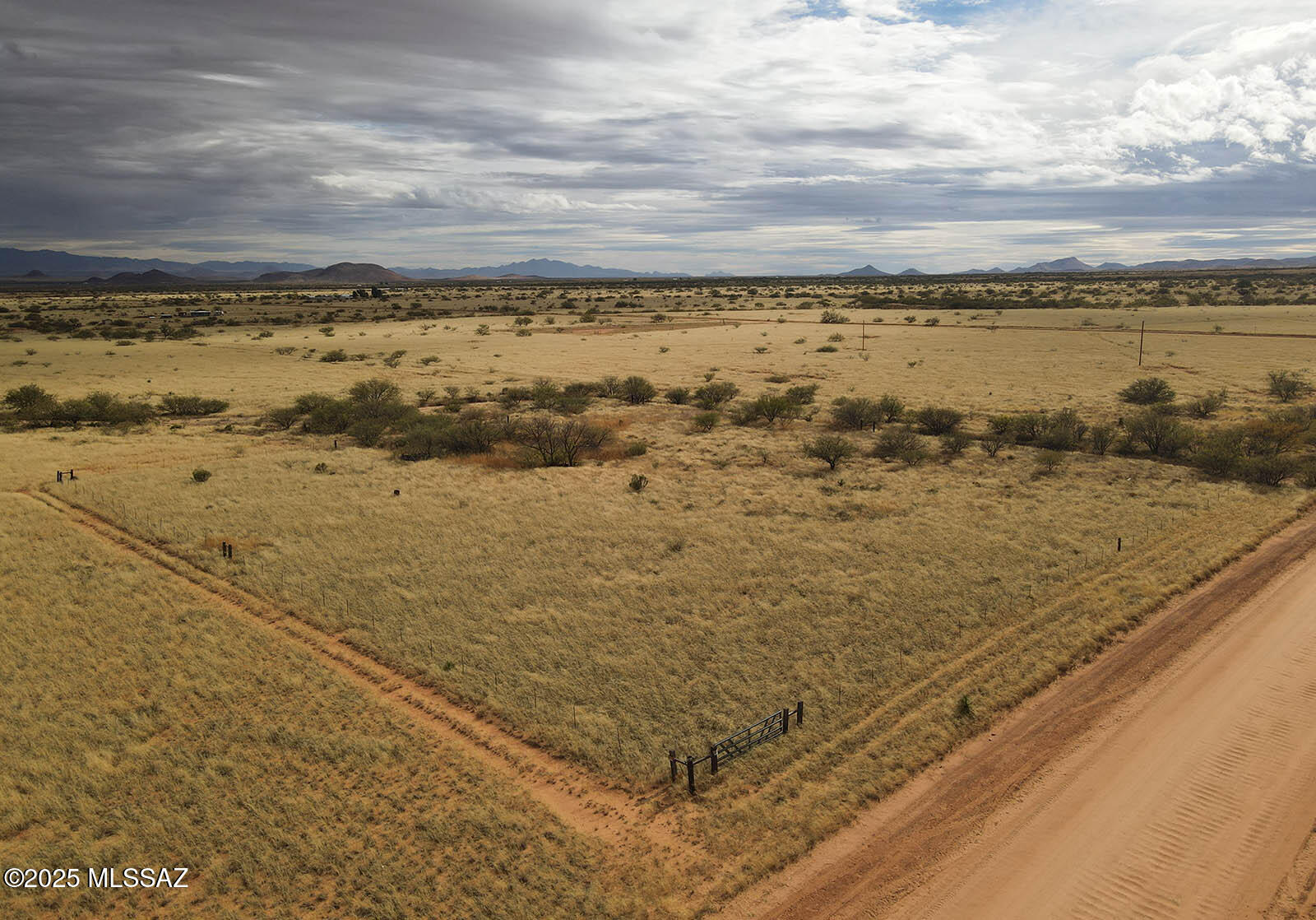 Two fenced & gated lots comprising 2.14 acres, located on the corner of county-maintained Desert Rd. & E Rising St. Survey completed in '22 included w/ sale. Impressive closeup views of the Dragoon Mountains and just minutes from Cochise Stronghold for hiking and endless exploration. Flat & protected land with easy road access less than a mile from pavement. Off-grid home OK or power is a few hundred feet away. Drill well, catchment or haul water. Zoned SR-43, site-built homes. Grandfathered grazing in area which makes the fencing a MUST. These lots are at 4,600 feet in elevation; making for mild summers and a great growing season. Escape the chaos of the city and stake your claim in this historic and peaceful high desert. *Sale includes two parcels, Cochise APNs 115-09-421 & 115-09-422