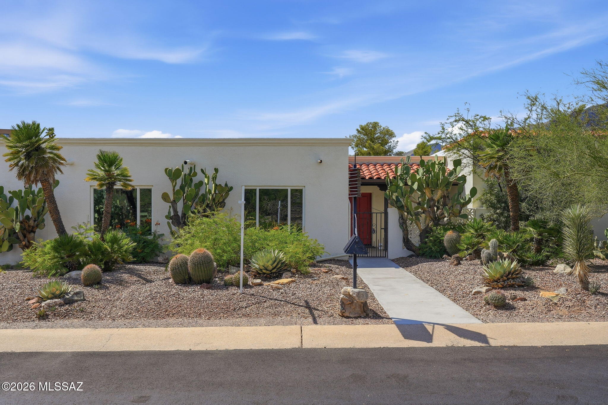 Discover this move-in ready Mid-Century Modern Bel Air Townhome in the highly sought-after Catalina Foothills and top-rated District 16. Thoughtfully updated while preserving its timeless architectural character, this home features a spacious great room with soaring ceilings, a dramatic wall of windows, cozy fireplace, updated kitchen, and dining area perfect for entertaining. Major upgrades include a new A/C unit, new sewer line, upgraded windows, Roof and fresh interior paint, offering peace of mind for years to come. Enjoy multiple outdoor living spaces, including a private front courtyard and oversized patio. Community pool just steps away, with easy access to Sabino Canyon, premier golf, upscale shopping, restaurants, TMC, and the best of Tucson living.