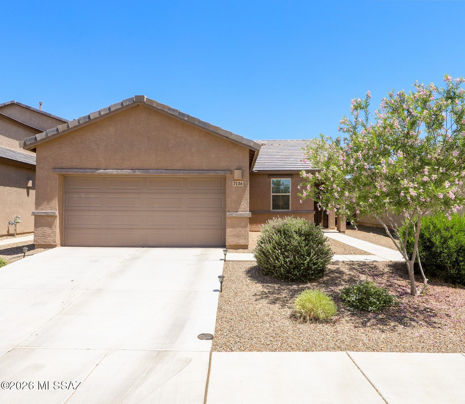 Welcome to a beautifully upgraded, single-level home where modern low-maintenance living meets smart design. An open-concept footprint seamlessly unites the Great Room and kitchen, maximizing space for entertaining. The thoughtful split floor plan places two bedrooms off the foyer and the private primary suite at the back of the home.

You'll find elegant tile throughout high-traffic areas and cozy carpet in the bedrooms. Every room features ceiling fans and fresh paint Storage is optimized with added custom shelving in the primary, office, pantry, and laundry room. Best of all, the kitchen appliances, washer, and dryer stay! Step outside to a pristine, zero-maintenance artificial turf backyard. 
Fully turn-key and ready for you!
