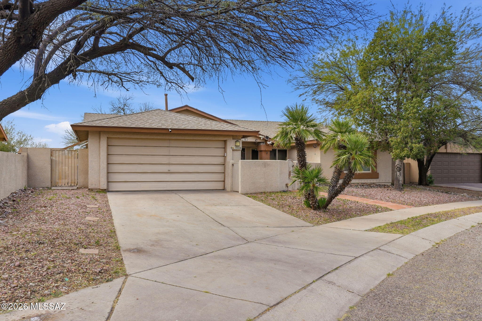 Shows beautifully! Well-maintained home featuring a 3 bedroom plus large den split bedroom floor plan with spacious living areas and great natural light. The kitchen opens to the main living space, creating a comfortable layout for everyday living and entertaining. The backyard is designed for Arizona living with a large covered patio with ceiling fans, built-in BBQ, brick paver patio, and built-in hot tub perfect for relaxing or hosting gatherings. The property also features a private front courtyard, 6-foot block wall for privacy, mature landscaping, and storage shed that conveys. Mini-split systems in every room provide efficient comfort year-round and help keep energy costs down.