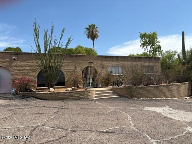 Lovely 4bd, 2.5 bath property with a private backyard, pool, and beautiful mountain views. Interior needs updating.