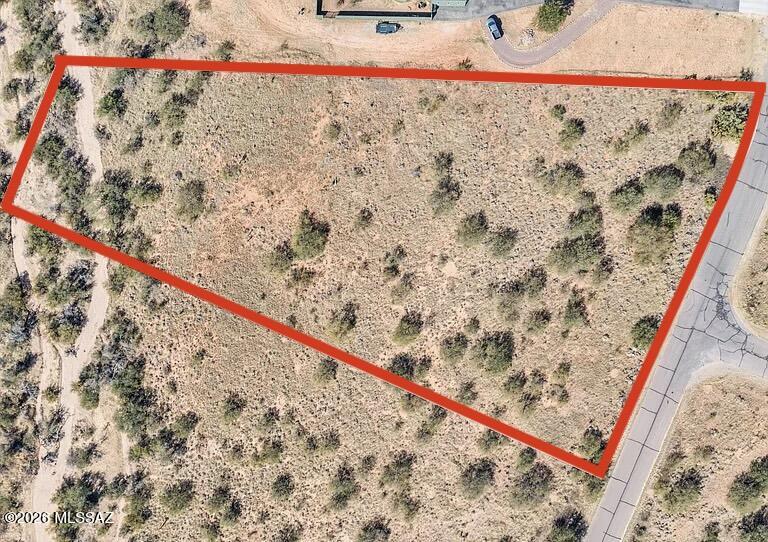 Discover the perfect setting for your future home on this stunning 3-acre lot in the desirable Red Hawk at J-6 Ranch community in Benson, Arizona.  Surrounded by sweeping panoramic mountain views and endless Arizona skies, this property offers the peace and privacy you have been searching for.
With paved roads, underground electric, and water available at the property line, the groundwork is already in place to make building simple and stress free.  Conveniently located just off i-10, you will enjoy rural tranquility while still being only 15 minutes from downtown Benson and 30 minutes from Tucson for shopping, dining, and everyday conveniences.  This is the ideal canvas for a custom home, weekend retreat, or long-term investment in one of