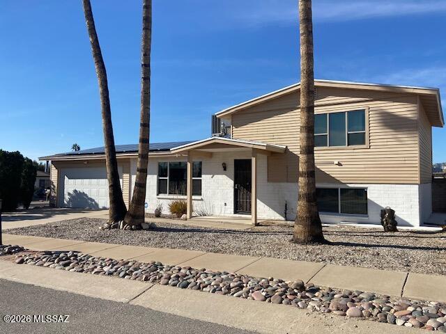 3 bedroom, 2 bath split level contemporary home with a pool and 2 car garage.  Good sized kitchen with granite counters, eat in area and extra cabinet storage.   Corner lot, with storage in the garage and a shed out back.  Two water heaters.  Nice location with lots of value.  Take a look.