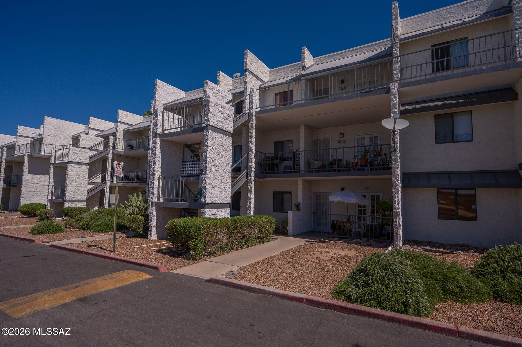 Top-floor living means added privacy, less noise, and stunning mountain views from both the front of the unit and the bedroom window. This beautifully maintained home features a spacious balcony entry with elegant French doors and a security door for added comfort and peace of mind. Inside, you'll find fresh paint, newer carpet, and a neutral color palette ready for your personal touch.

The open den flows seamlessly into the living room, creating a bright and versatile living space. The large kitchen comes fully equipped with all appliances included, and convenient washer and dryer hookups are located inside the unit. Enjoy comfortable living with incredible views in a quiet, desirable top-floor location.