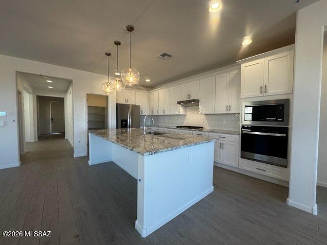3-bedroom, 2.5-bath home with inviting indoor-outdoor living. Enjoy your morning coffee on the covered back patio. Inside, the kitchen island opens to the great room and dining nook, ideal for entertaining. The private primary suite is separated from the secondary bedrooms and features dual sinks and a spacious walk-in closet. Located in Arbor at Madera Highlands, offering upgraded finishes, gourmet kitchens, and open layouts, plus amenities like a pool, playground, and walking trails. Move-in ready with washer, dryer, fridge, and whole-home blinds.