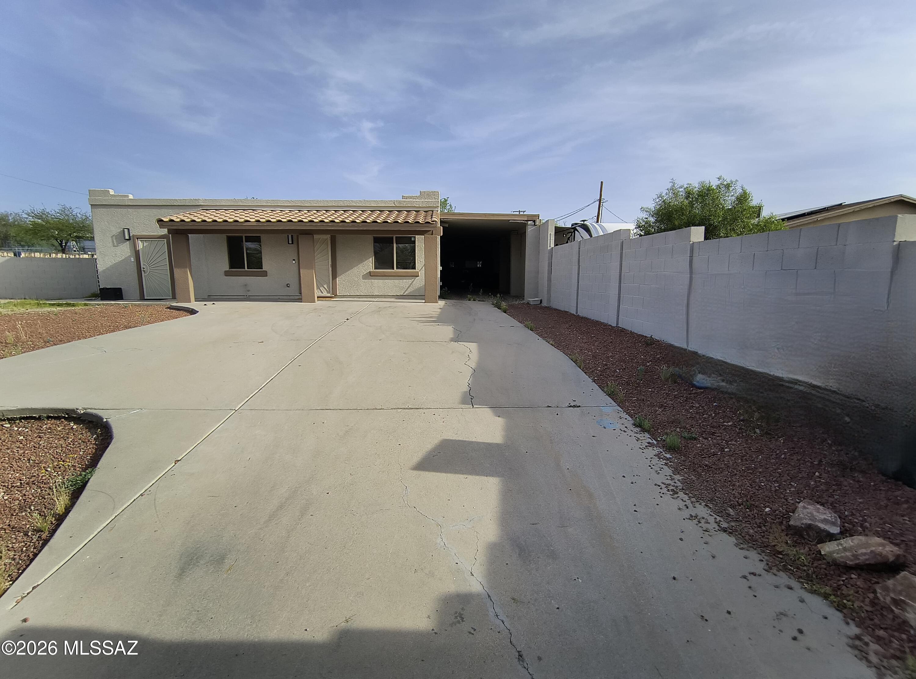 Charming single-story residence offering approximately 1,530 square feet of living space on a spacious lot. This home features a functional floor plan with 2 bedrooms, 4 bathrooms, and covered parking. The property includes a fenced lot and convenient indoor and outdoor living areas. Located in Tucson, this home provides easy access to major roadways, shopping, dining, parks, and local amenities.