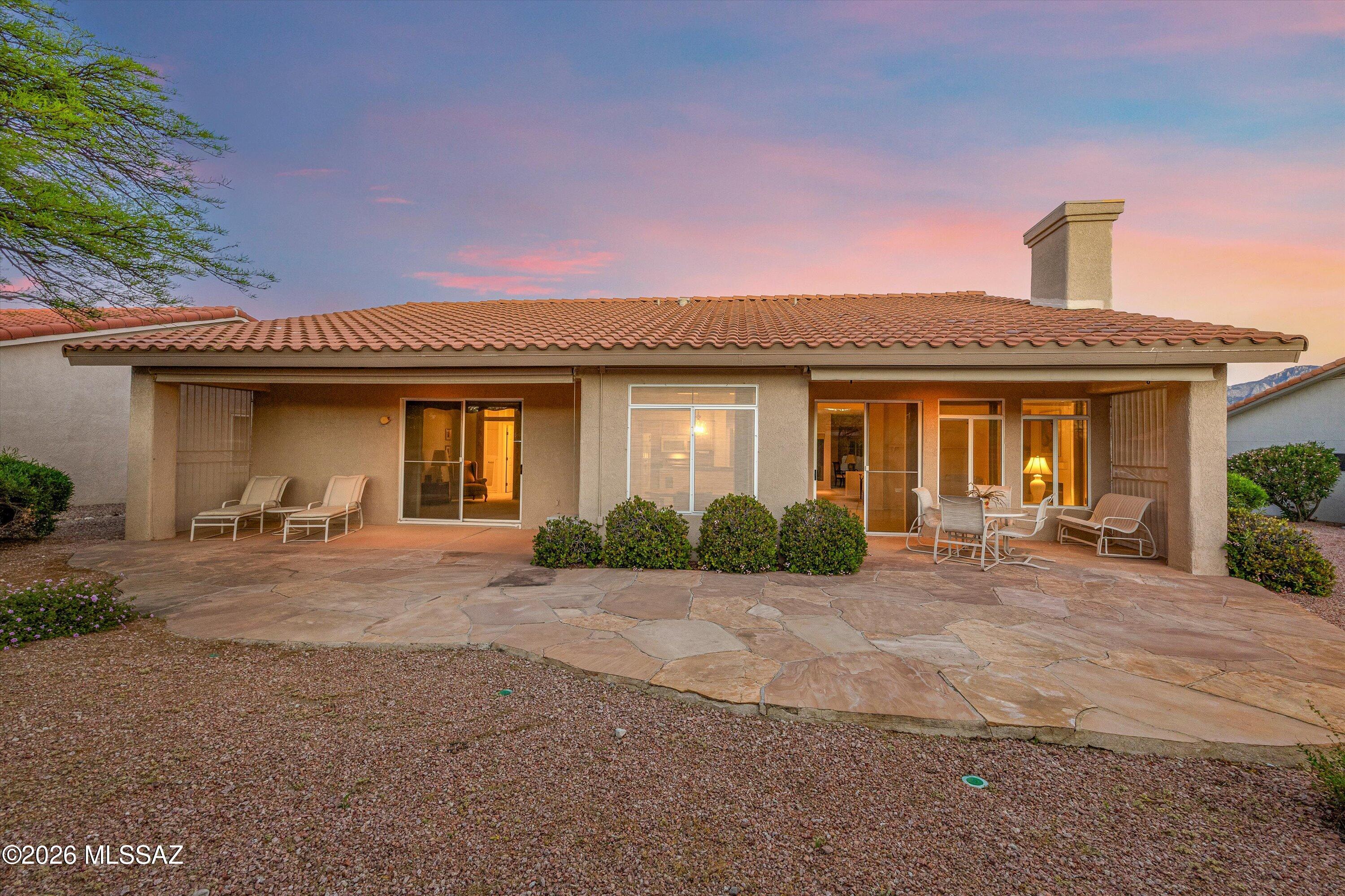 This one-owner home in the heart of Sun City Oro Valley has been wonderfully maintained! This 2-bed, 2-bath property features an expanded guest bedroom, along with dual back covered patios. Roof underlayment completely replaced in 2023. The primary suite has a walk-in tub,  large walk-in closet with built-in shelving, and a sliding door for private access to the second covered patio. The off-kitchen family room has a gas fireplace, and the kitchen has been updated with quartz countertops. The two-bay garage has built-in storage cabinets and an epoxy floor coating. Spend time golfing with friends and relaxing by the pool at this 55+ community with outstanding amenities and incredible mountain views.