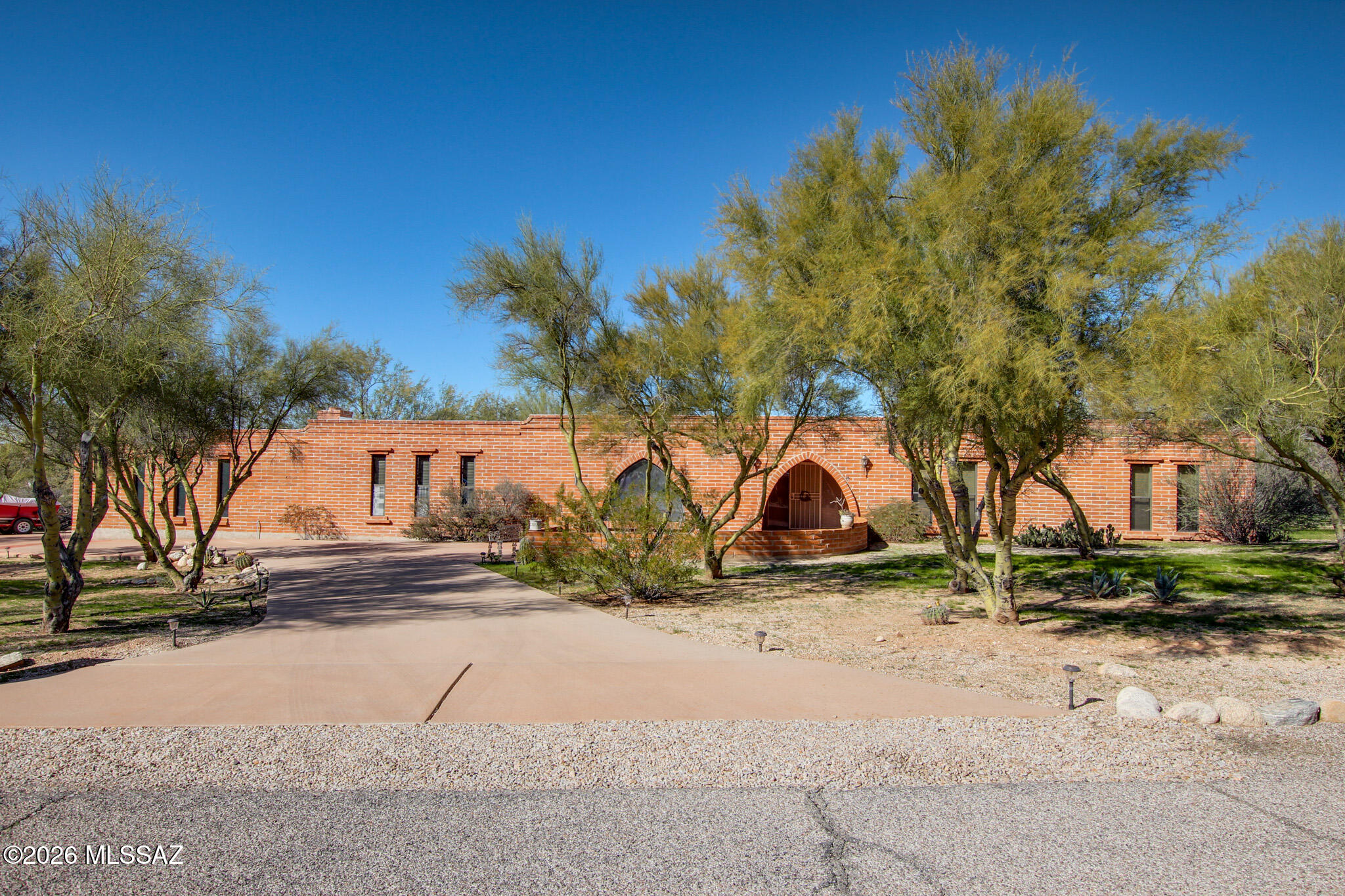 Classic adobe home in the heart of Casas Adobes, built with over 12,000 adobe bricks for exceptional construction and insulation. Nearly 3,500 sqft on just under an acre with a walled yard, pool, pond, and mature desert landscaping. One of the largest homes at this price point in the corridor.
Flexible layout includes 4 bedrooms plus a game room with fireplace, wet bar, and direct garage access. Perfect as a rec room, home office, or flex space. An ideal canvas for a buyer ready to put their own stamp on it.
Priced to reflect condition and priced to move. Updated homes nearby are selling above $800,000. The bones, lot, and location are all here. Prime Ina and Oracle location minutes from shopping, dining, the Foothills, U of A, Downtown, and I-10.