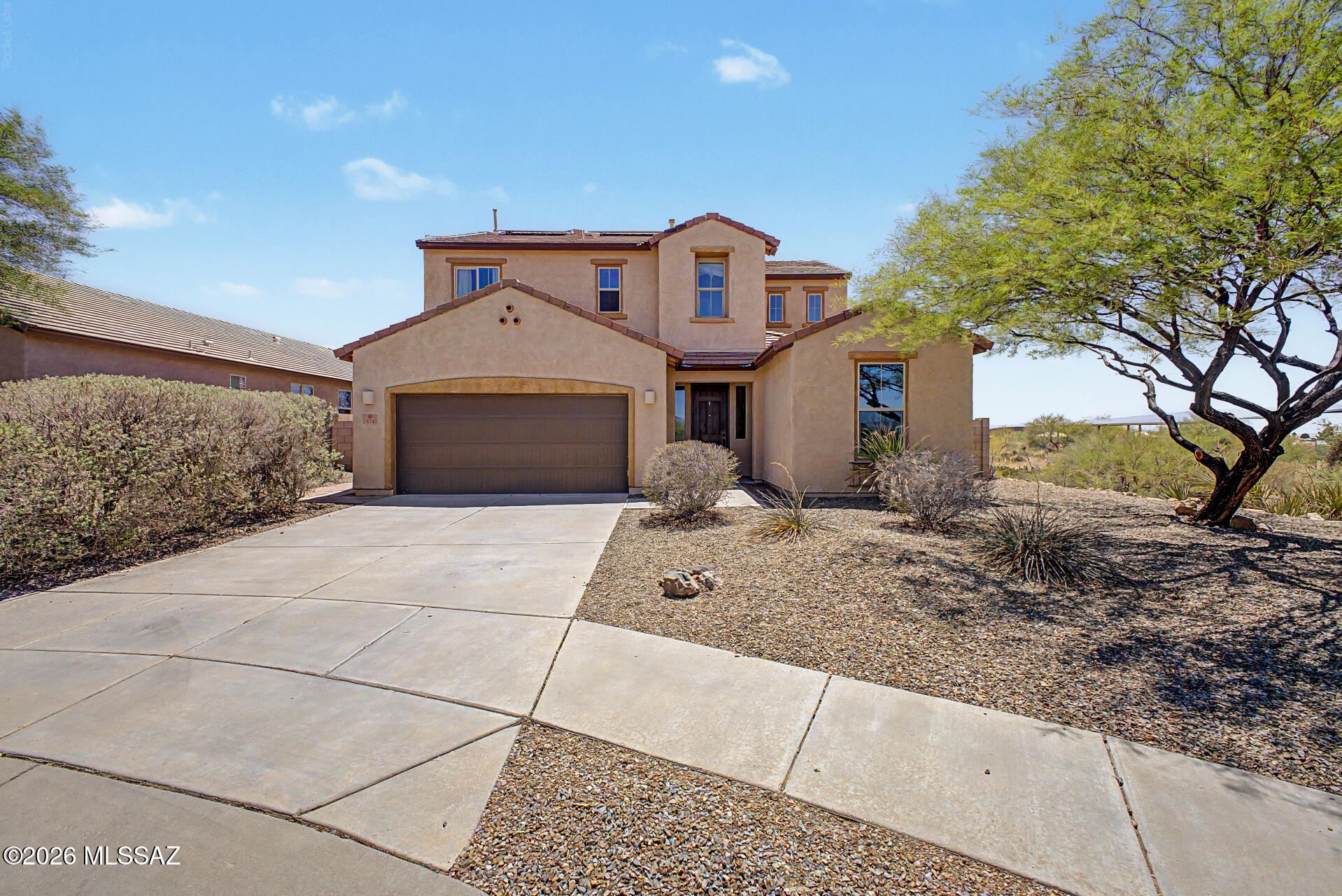 DREAM HOME ALERT! Spacious two-story home in VAIL AZ! 5 Rooms! 4 Beds w Den. 3 Bath. Nestled in a quiet cul-de-sac w beautiful views and a 2-car garage. Interior showcases a thoughtfully designed layout with tile floors, contemporary lighting, and plenty of space for entertaining and storage. Kitchen comes equipped with mocha cabinets, tile backsplash, granite counters, SS appliances, an island, and a walk-in pantry.  Relax after a long day in the main retreat, w a walk-in closet for effortless organization and a full ensuite with double sinks for convenience. The den offers flexibility, working perfectly as a home office or hobby area. Award winning Vail School District. Solar Panels provide ample cost savings. Assumable 3.125% Rate w 59k down for VA Qualified Buyers. 2,155.04 a month. Get ready for weekend grills and peaceful evenings in the backyard, featuring a covered patio ideal for morning coffee, artificial grass, and a seating space with a bench and a fire pit, perfect for late nights. What's not to love? Make it yours!