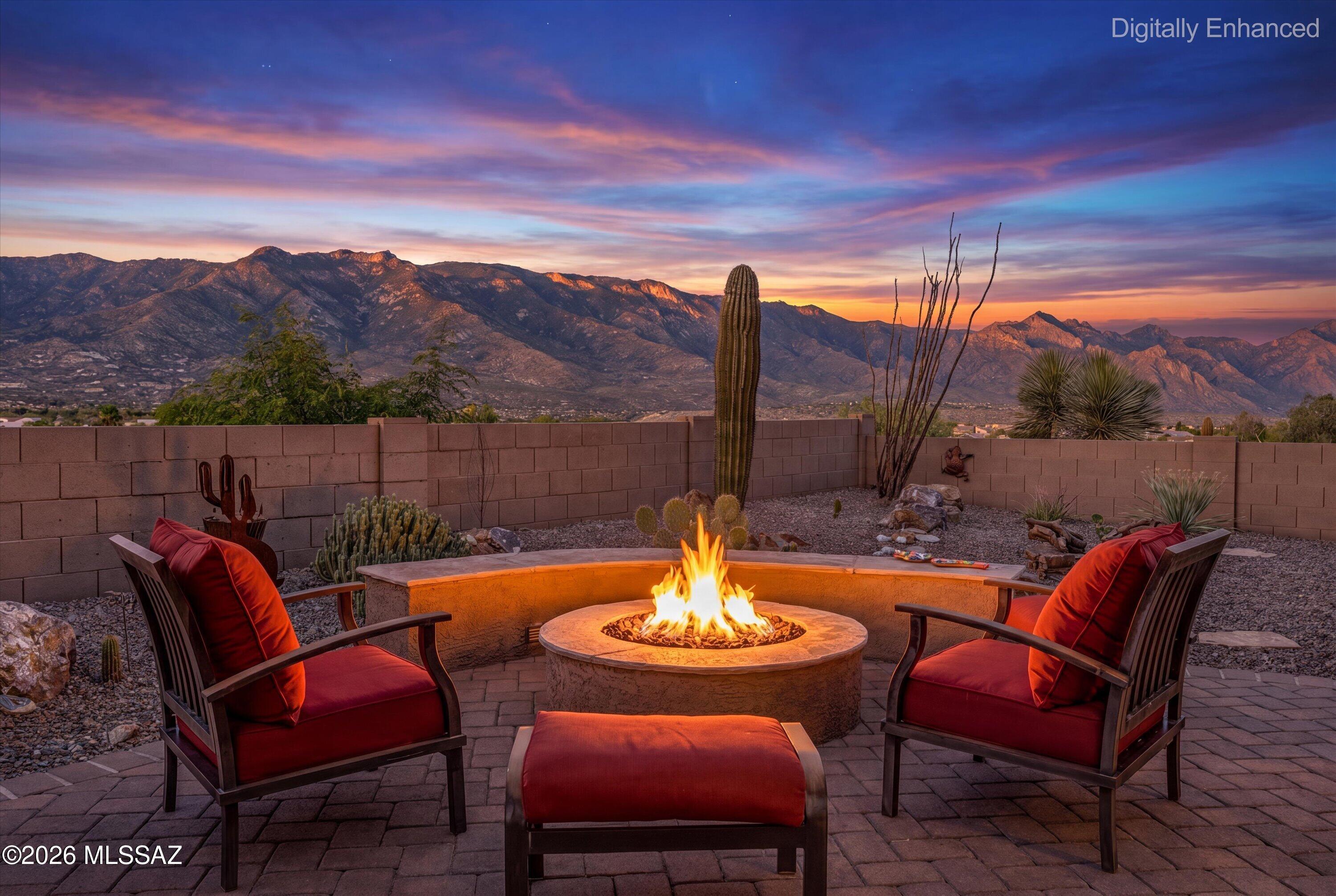 Experience breathtaking panoramic mountain views from this elevated lot, enjoyed from both inside the home and the private backyard. The extended brick paver patio, built-in BBQ, and tranquil water feature create the perfect outdoor retreat for entertaining or relaxing. This beautifully updated Montana model features a truly open-concept design with the pantry removed to maximize sightlines from the kitchen through the great room to the stunning views beyond. Offering 2 bedrooms plus a den with custom built-ins, the spacious primary suite includes an ensuite bath and large walk-in closet. Tile flooring throughout the main living areas, neutral paint, an extended garage, brick paver driveway, and inviting front courtyard add to the home's appeal. Major updates include new roof underlayment (2026), water heater (2026), HVAC (2018), and most windows replaced. Located in SaddleBrooke HOA2, a premier active adult community offering golf, pickleball, tennis, fitness centers, swimming pools, restaurants, clubs, arts, and countless social activities.  Optional turnkey package available on a separate Bill of Sale.