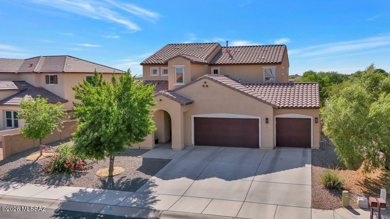 Welcome HOME. Located in the heart of Gladden Farms, this stunning 4-bedroom 3.5-bath home is waiting for  you. Step inside through the custom First Impressions iron entry door (with operable inswing glass pane) as you take in all this beautiful home has to offer. House has a RARE 4-CAR GARAGE with epoxy flooring. Kitchen is beautifully updated with quartz counters, stainless appliances, pot filler, tile backsplash and soft-close cabinets. Kitchen also features a RARE butler's pantry. Primary bath has been fully remodeled with walk-in oversized shower, rain shower head, quartzite countertops, and custom vanities. No neighbors directly behind you - lush backyard view overlooks grassy parks and walking trails. First floor primary bedroom, three secondary bedrooms upstairs, one complete with ensuite bathroom. All bedrooms feature walk-in closets. Second floor has a large loft / flex space. Low-maintenance backyard with artificial turf provides plenty of space to entertain. House also comes with a soft water system. Don't wait - this home is competitively priced for a quick sale.