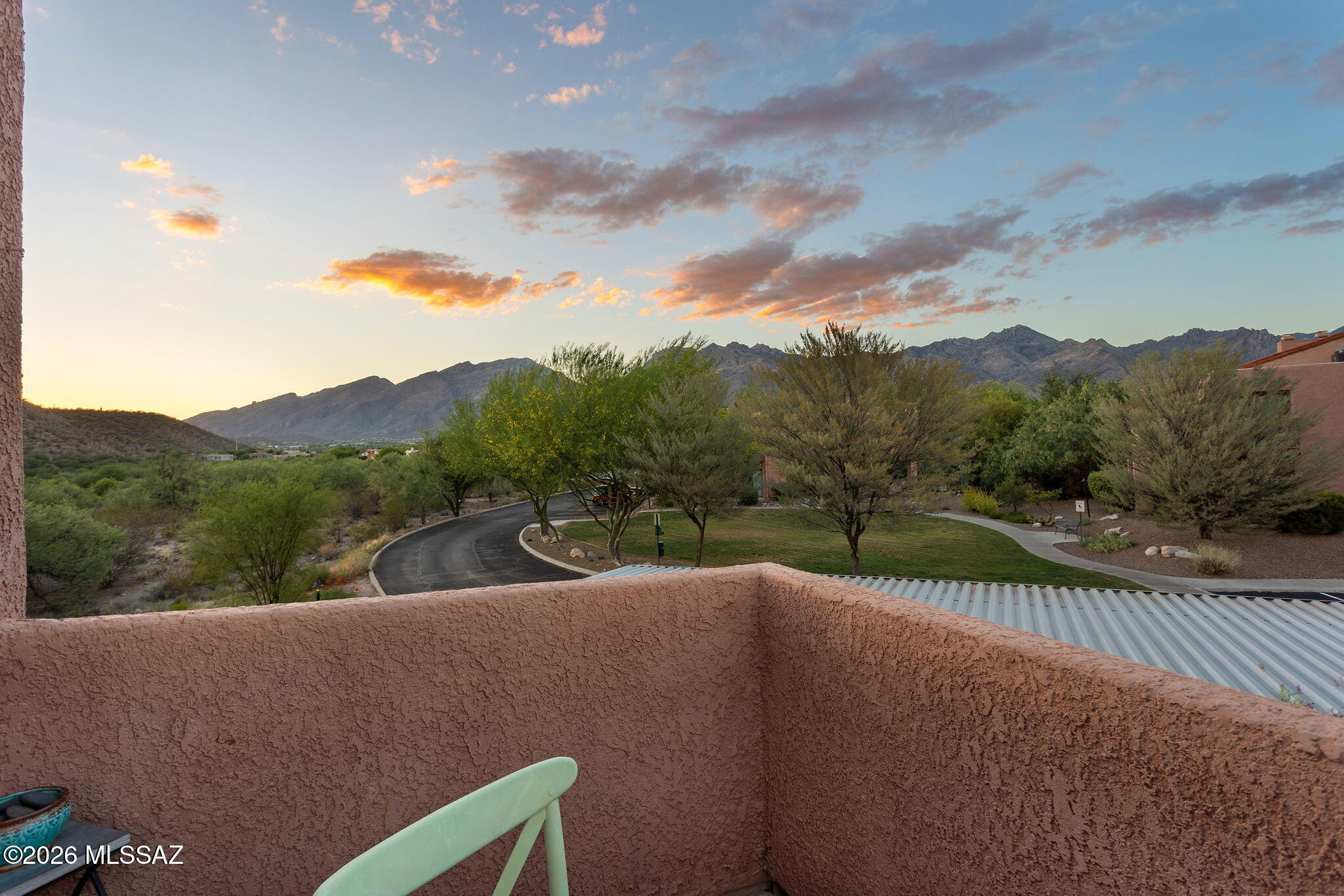 Enjoy views of the Catalina Mountains from your balcony! Move in ready condo with many features including wood burning fireplace, tile flooring throughout, Corian countertops in the kitchen, tile counter tops in bathroom and tile surround in shower. Vaulted ceilings with highlight windows for lots of natural light. New HVAC system installed in 2024 and new water heater in 2025.  Gated community with resort style amenities including pool, recreation room, tennis court, pickleball, and 2 spas.
