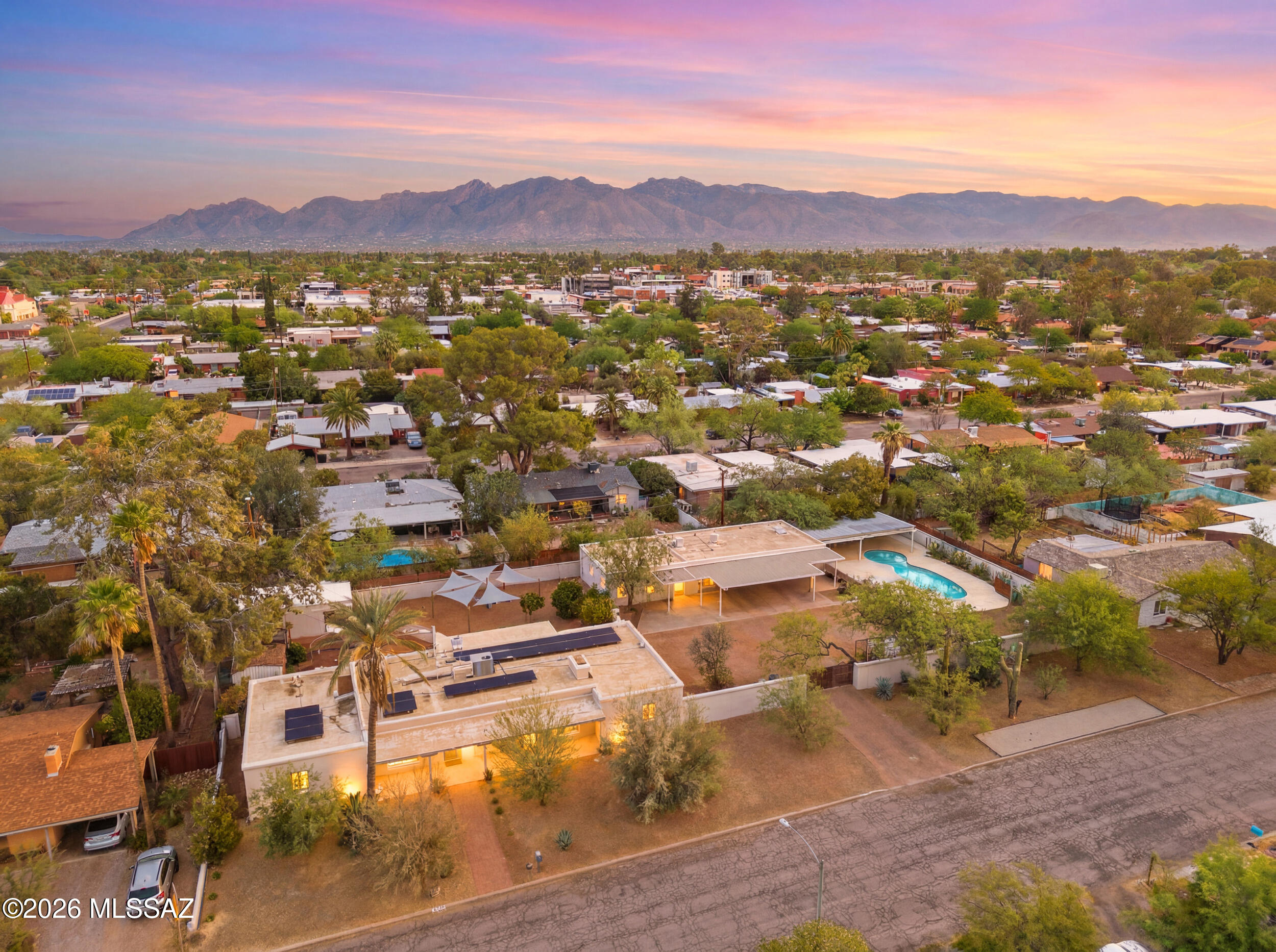 Central Tucson living rarely comes with this kind of flexible architecture! Tucked inside the coveted Broadmoor Historic District, this property delivers three distinct living spaces on a single, triple lot: a 4-bed, 2-bath main house with chef's kitchen, black quartz counters + stainless appliances; a fully refreshed 411 sq ft studio guest house; and a 667 sq ft 1-bedroom apartment. Live in one, rent two, or perfect for multi-generational living. Major capital improvements already done- solar with battery backup, updated gas line, lined plumbing, fresh finishes throughout. The resort-style backyard features a pool, outdoor kitchen + covered ramada. 3 garages, carport, tons of gated, off-street parking and workshop to round it out. Unassuming from the street. Exceptional from within.