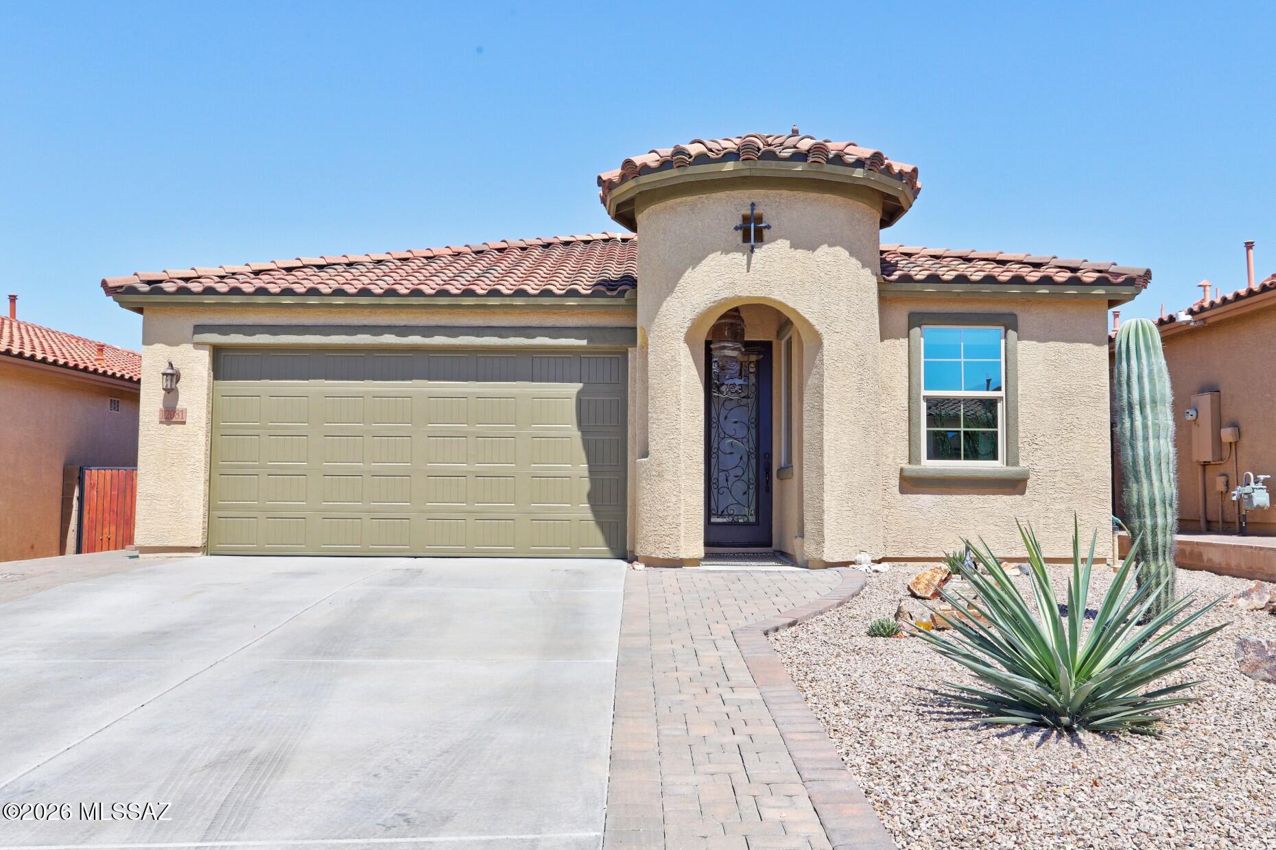 Located in the gated community of The Preserve at Dove Mountain, this upgraded 3BR/3BA Maracay home offers luxury, comfort, and privacy. Stunning curb appeal features a custom 8-ft front door and imported entry lantern.Inside, enjoy 12x24 masonry-set tile, soaring ceilings, crown molding, coffered ceiling, 5-inch baseboards, 8-ft doors, designer lighting, and a striking porcelain accent wall. The gourmet kitchen boasts Cashmere White Auburn Glaze cabinetry, upgraded granite counters, stone backsplash, double ovens, gas cooktop, breakfast bar, island sink, and walk-in pantry. Spa-like baths feature granite vanities and floor-to-ceiling tile ceiling track system giving it a spa-like feel. The private backyard includes travertine tile, a gas BBQ hookup, and gas firepit and preserve views!