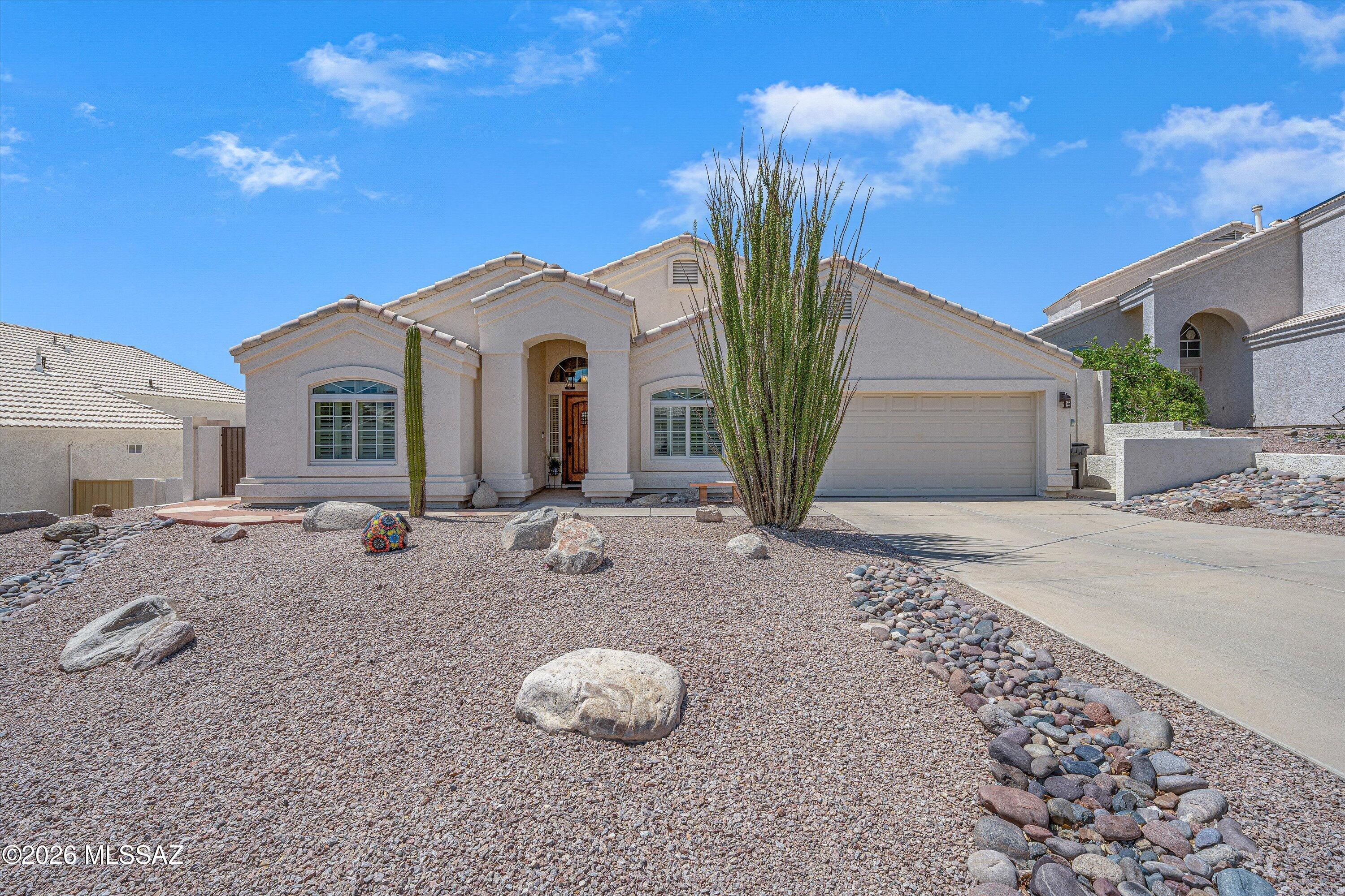 Beautifully maintained with quality upgrades & documented care throughout, this 4-bedroom,
2-bath home offers a truly move-in-ready opportunity. The extensive maintenance records & documentation that accompany this home are a rare benefit for buyers. Situated on a quiet cul-de-sac in a well-established Northwest Tucson neighborhood with no HOA, this home enjoys an elevated setting with mountain views. Conveniently located near shopping, dining, Costco, major roadways including I-10, & everyday amenities, this home offers a peaceful neighborhood setting with easy access to destinations throughout Tucson.
Maintained by the same owners, this home reflects consistent attention to detail throughout. A custom Alder wood front door by Arcadia creates a warm first impression upon entry. Interior features include 24-inch porcelain tile the main living areas, engineered hardwood flooring in the bedrooms, solid wood plantation shutters, triple-pane windows, custom solid
wood bathroom cabinetry, & a well-appointed kitchen with soft-close cabinetry & convenient pull-out lower drawers. The living room features a gas fireplace & professionally installed 5.1 surround sound system, creating a comfortable setting for everyday living & entertaining. Designed for relaxing & entertaining, the backyard features a PebbleTec spool with 10 spa jets, waterfall, underwater lighting, pop-up cleaning system, & low-voltage landscape lighting. A
covered patio with a remote-controlled sun screen, ceiling fan, and lighting extends the outdoor living space where mountain views can be enjoyed. Decorative metal artwork in the front entry & backyard, along with the spool umbrellas, will convey with the property.
Additional highlights include a Daikin HVAC system installed in 2017, whole-home Aerus Air Scrubber/Pristine Air Purifier installed in 2021, Tesla solar system, & documented professional HVAC maintenance every spring & fall. A comprehensive homeowner binder containing
maintenance records, warranties, appliance manuals, and upgrade documentation conveys with the home, providing added confidence & peace of mind for the next owner. Quality craftsmanship, consistent maintenance, and extensive documentation come together to create a home that has been exceptionally cared for & is ready to be enjoyed by its next owner.