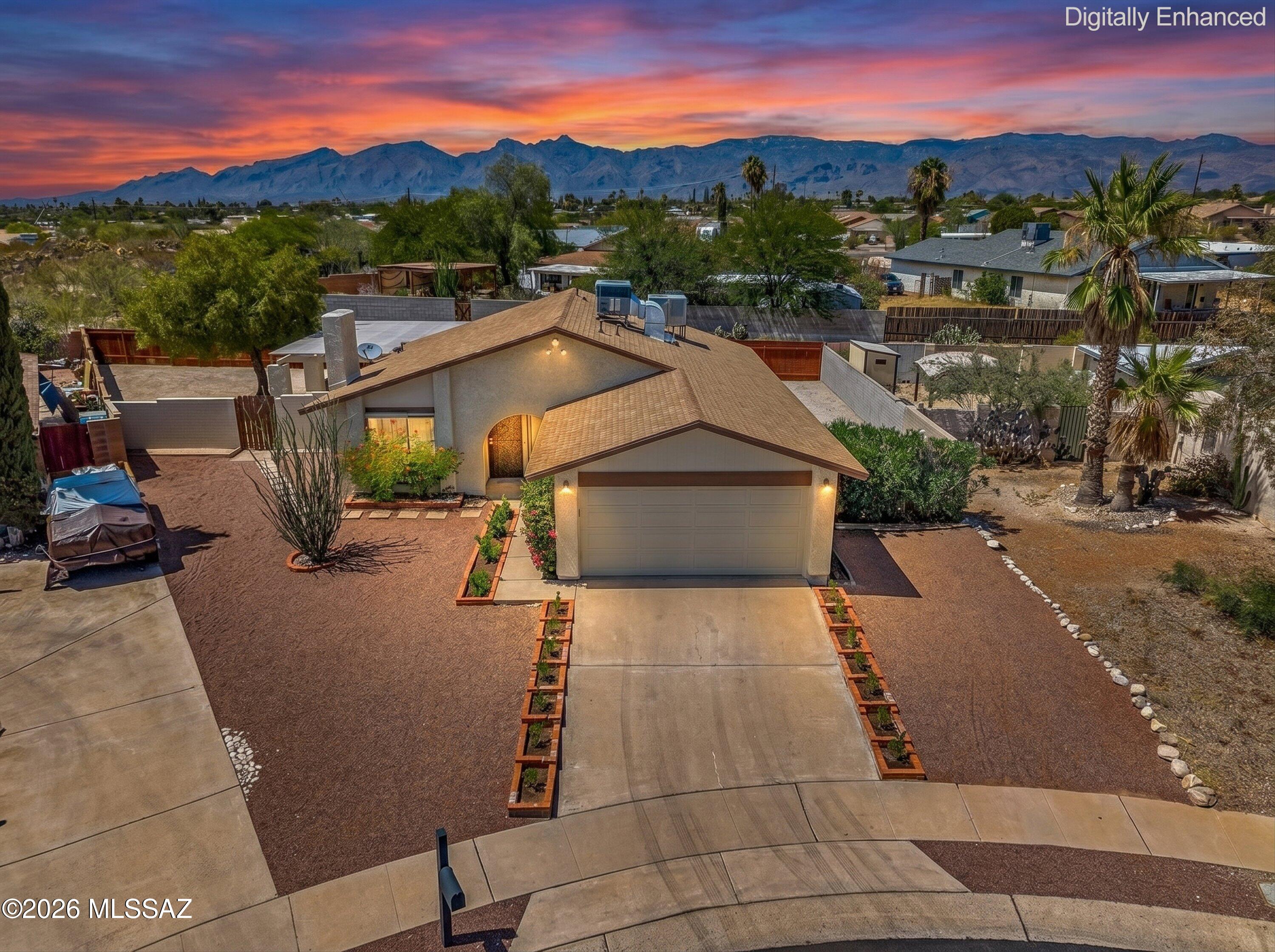 Lovely, very well-maintained home on a cul de sac w/ a HUGE walled in yard! This home has engineered-wood floors throughout, w/ tile in the kitchen & baths. The living room has a wood-burning fireplace, tons of natural light & a remote-controlled solar shade. The large kitchen has tons of storage, a slider to the covered patio/yard, includes all appliances, has another solar shade, & features a nice-sized dining area. Large primary bedroom has an en-suite bath & views to the yard. The 2 secondary bedrooms share a hall bath w/ tiled shower. The 2-car garage includes NEW washer & gas dryer and has epoxy floors. The yard is fully enclosed w/ a brand-new COR-TEN steel wall along the full length of the property. Check out the cool trellis-style patio roof. NO HOA! NOTHING TO DO HERE BUT MOVE IN