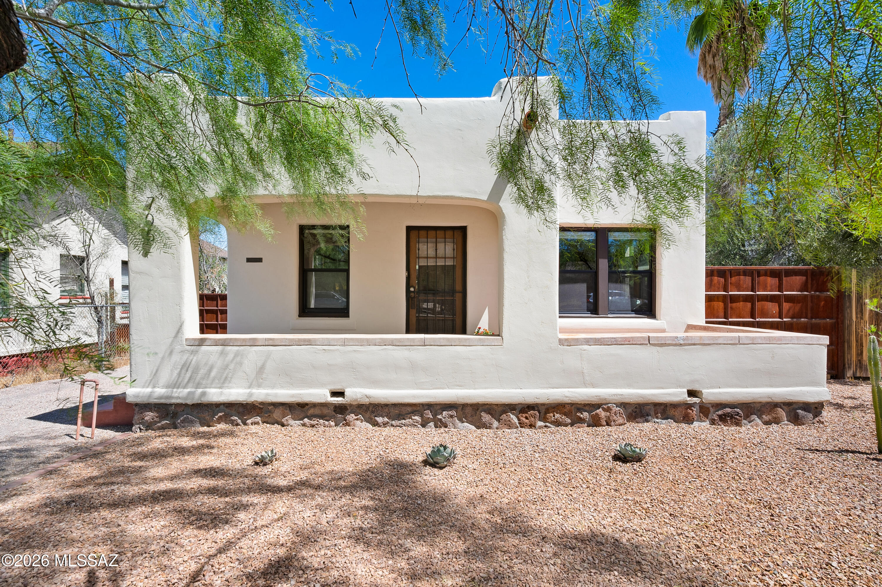 Charming 2-bedroom, 1-bath historic 1925 masonry bungalow in the desirable Feldman's District, just 0.5 miles from University Main Gate Square. This classic home blends timeless 1920s character with modern updates, including laundry room with washer/dryer, new roof, new windows, HVAC system, water heater, and new water and sewer lines. Situated on a quiet neighborhood street, this UArizona-area home also benefits from a historic tax credit, with annual property taxes of only $788. No HOA or CCRs. The low-maintenance 0.11-acre lot features off-street parking, double-gate backyard access, new pergola and shed. A rare opportunity in one of Tucson's sought-after historic neighborhoods.