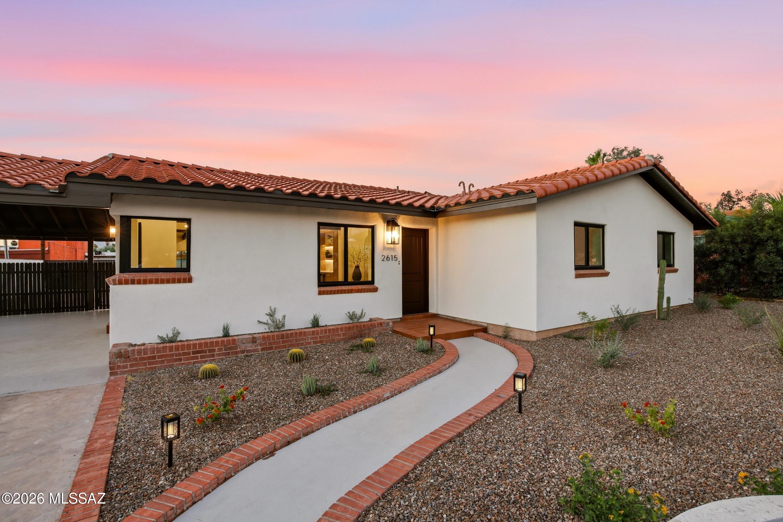 Nestled in Tucson's historic Broadmoor neighborhood, this exceptional 3-bedroom, 2-bath residence offers the perfect balance of historic charm and modern luxury.
The heart of the home is a show-stopping chef's kitchen featuring custom white oak cabinetry, a custom statement range hood, polished brass and white appliances, a handcrafted Spanish tile backsplash, an expansive wet bar, and an impressive 10-foot island designed for gathering and entertaining. The spacious living room is anchored by a stunning fireplace with custom arched built-ins, while the generous dining area creates the perfect setting for hosting family and friends.  
The luxurious primary suite is a true retreat, showcasing a spa-inspired bathroom with a walk-in glass-enclosed shower, a freestanding soaking tub,... dual vanities, and exquisite marble arabesque flooring that perfectly complements the home's timeless Spanish aesthetic.
Outside, the charm continues. The beautifully landscaped front courtyard welcomes you with a striking fountain, while the fully enclosed yard and carport are secured by elegant wrought iron gates, offering both privacy and curb appeal.
The backyard is your own private oasis, featuring a sparkling pool accented with Spanish tile, a spa that gracefully spills into the pool, a covered patio for relaxing or entertaining under the Arizona sky, and an oversized 8-foot gate providing convenient additional access.
Every detail has been thoughtfully curated by C & Q Designs to preserve the character of this home while delivering the luxury and functionality today's buyers desire.
This isn't just a renovation--it's a masterpiece that celebrates the beauty of Spanish architecture with a fresh, modern perspective.
Owner/Agent