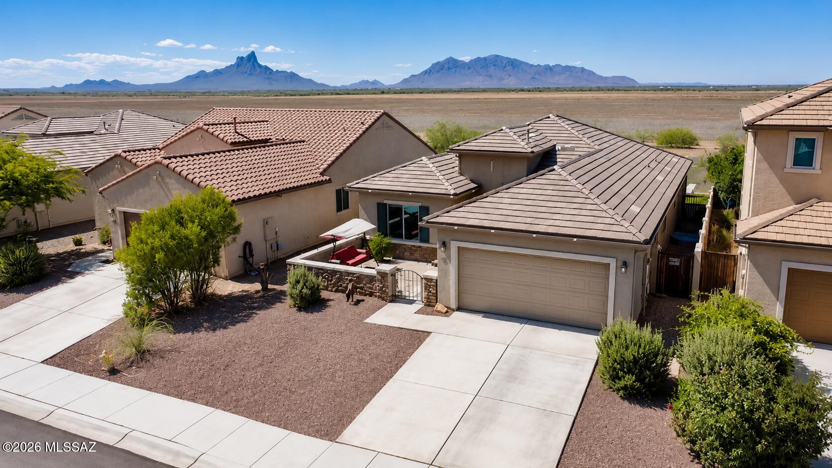 Enjoy mountain views and resort style living in this upgraded 3 bedroom home featuring an open concept floor plan, gourmet kitchen with granite countertops, built-in cooktop and microwave, upgraded tile flooring, recessed lighting, and tray ceilings. The spacious primary suite includes French door entry and an upgraded bath with a quartz countertop dual sinks. Outdoor highlights include a private front courtyard, extended covered patio, professionally landscaped backyard, and extended block wall for added privacy. Additional upgrades include an extended garage, water softener, reverse osmosis system, laundry room cabinetry, ceiling fans, and designer finishes throughout. Located in a desirable community with 2 pools, waterslides, parks, playgrounds, and waking trails. Please see upgrade list in document section.