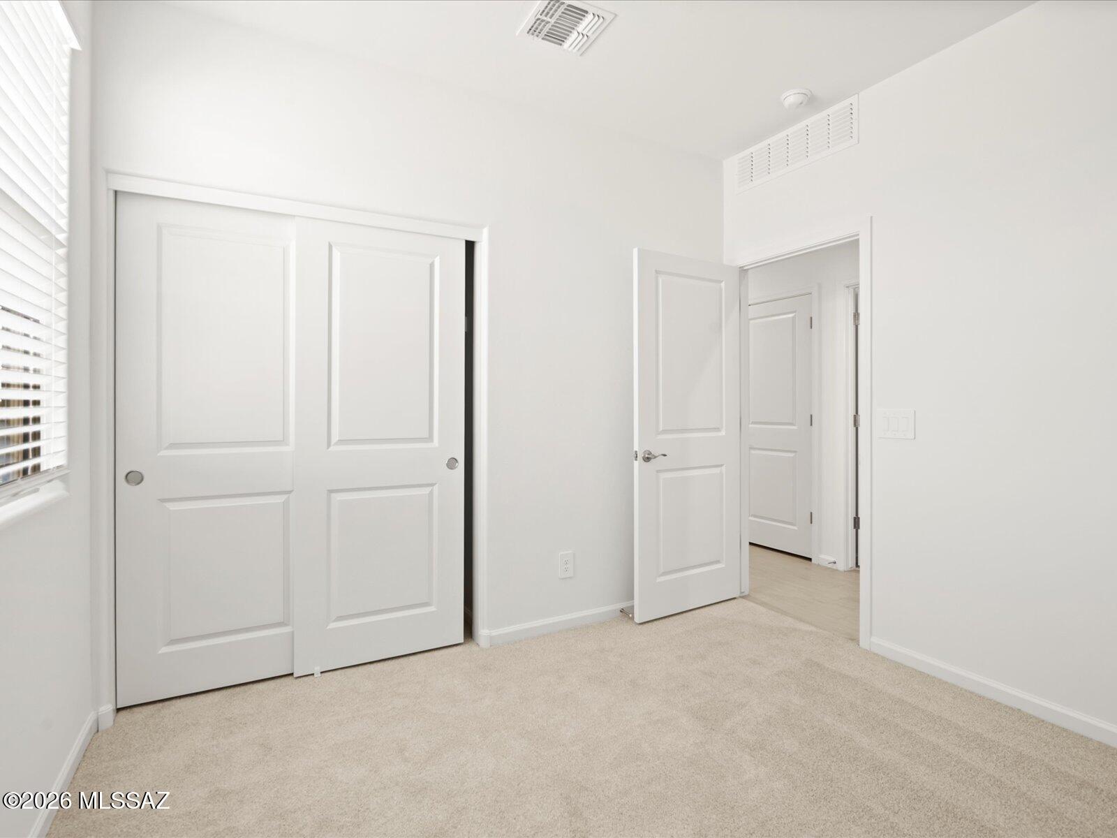 Discover this inviting home with a thoughtfully designed open-concept layout featuring 3 bedrooms and 2 bathrooms. A versatile flex room off the kitchen adds extra space for a home office, playroom, or hobby area. The spacious primary suite includes a generous walk-in closet to fit your entire wardrobe. Located in the growing Mandarina community in Marana, residents will enjoy future amenities like a resort-style pool, pickleball courts, playgrounds, and a dog park. Move-in ready with washer, dryer, refrigerator, and whole-home blinds. Built with energy-efficient features for comfort, savings, and peace of mind.