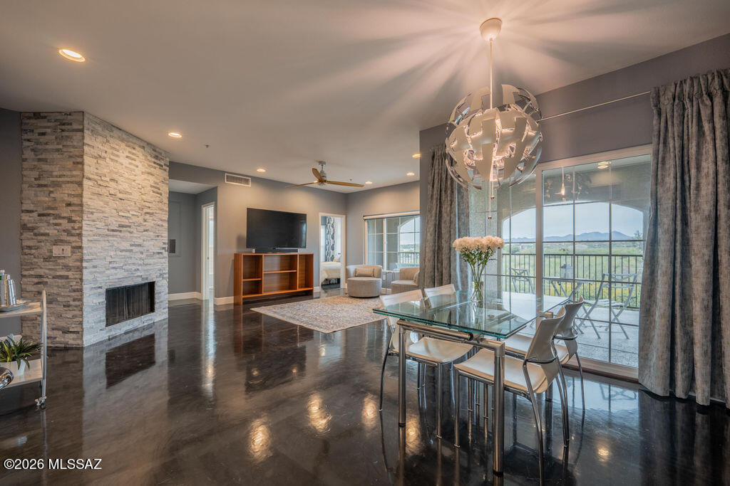 Nestled in the heart of Oro Valley, this fully remodeled, custom-designed condominium offers a level of quality and finish that truly sets it apart, surpassing every other unit in the community. Thoughtfully updated from top to bottom, the home showcases refined craftsmanship, modern finishes, and a bright, open layout filled with natural light. Located near the Pusch Ridge foothills, the community provides a peaceful setting with convenient access to shopping, dining, hiking trails, and Oracle Rd. This exceptional property is ideal as a primary residence, seasonal retreat, or standout investment, offering both style and the relaxed Oro Valley lifestyle.