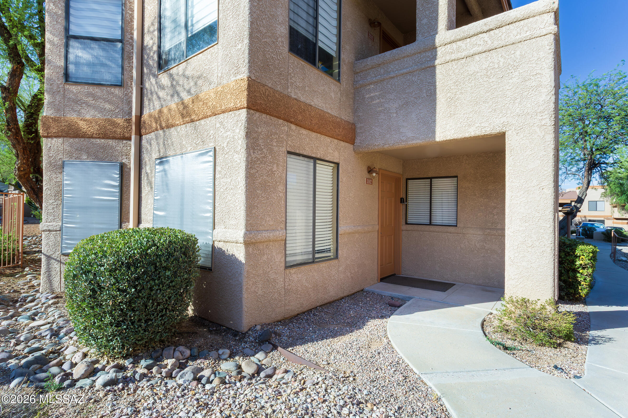 MOVE-IN READY - Fully Furnished RENTAL! Beautifully maintained 3-bd, 2-bth ground floor corner condo in a resort style gated community in the heart of the Catalina Foothills. This bright, open concept home features a spacious great room with a cozy fireplace, a primary suite with a sliding glass door leading to the covered patio just steps from the heated pool, spa, fitness center & BBQ area. Offered fully furnished with tasteful décor, housewares, linens, essentials. Kitchen with ample cabinetry, updated appliances, granite counters and convenient laundry closet in hall. Ideally located near resorts, golf, shopping, dining, Sabino Canyon & miles of scenic hiking trails. Gated Community Maintenance Includes: Common Area, Exterior, Street, Garbage, Sewer, Pool, Spa, Fitness & BBQ area.