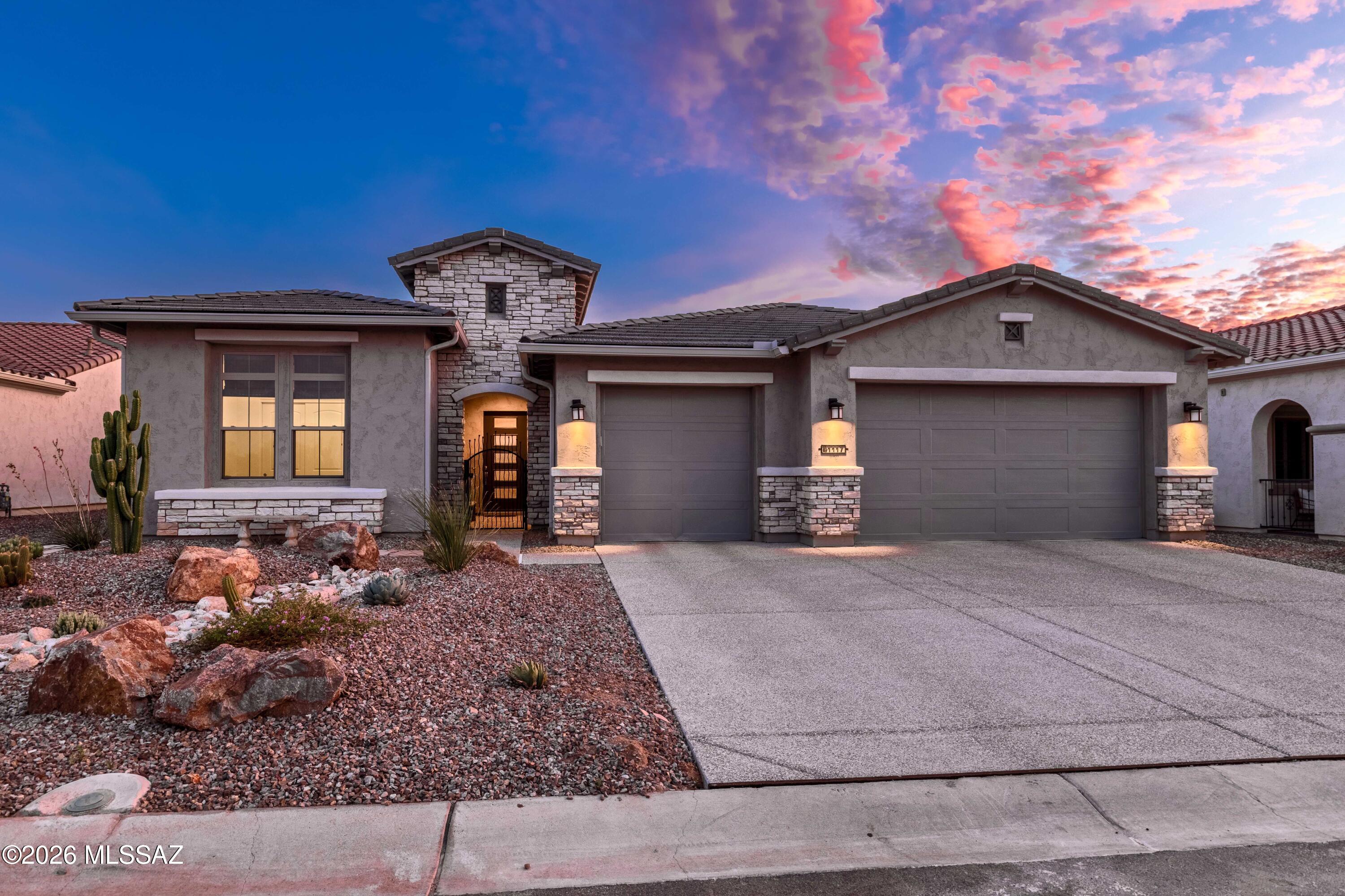 Your Private Desert Retreat with Breathtaking Mountain Views
Welcome to refined desert living in this stunning Avalon model located in the highly sought-after SaddleBrooke Ranch community. Offering nearly 3,000 square feet of thoughtfully designed living space, this exceptional residence features a highly flexible layout with two spacious bedrooms, a den, and an additional office/bonus room with double doors and a closet--ideal for a variety of uses such as a home office, guest space, or hobby room. From the moment you step inside, you'll appreciate the extensive upgrades and attention to detail throughout. The gourmet kitchen is beautifully appointed with rich maple-stained cabinetry, elegant quartz countertops, and upgraded stainless steel appliances, including the refrigerator. The open-concept design flows seamlessly into the great room, creating an inviting space filled with natural light.
The spacious primary suite offers a luxurious retreat, complete with a large walk-in shower and a custom-designed walk-in closet with built-in organization. Additional features include a washer and dryer, adding convenience and value.
Step outside to your private backyard oasis, where fully landscaped and fenced grounds provide both beauty and privacy. Enjoy stunning, unobstructed views of the Catalina Mountains and Mt. Lemmon, enhanced by a natural arroyo behind the property that creates a peaceful buffer with no direct rear neighbor. The outdoor space is further highlighted by a charming cactus fountain and a cozy outdoor fireplace--perfect for relaxing, entertaining, and taking in Arizona's breathtaking sunsets.
Completing the home is an extended three-car garage, providing ample space for vehicles, golf carts, and storage.
This spectacular home truly has it all--luxury, flexibility, privacy, and unforgettable mountain views. A must-see opportunity in SaddleBrooke Ranch.