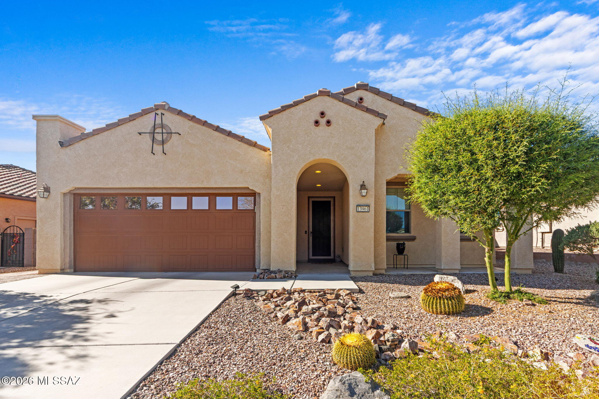 Welcome to this beautifully upgraded home in the desirable community of Del Webb at Dove Mountain. Thoughtfully improved and maintained, this property features balanced natural lighting, new tile flooring, new granite countertops, and an updated guest bath with spacious walk-in shower, adding both comfort and functionality. Step outside to enjoy an inviting backyard designed for Arizona living. The extended tiled patio, custom pavers, and custom grilling area create the perfect setting for entertaining and relaxing. With convenient access to shopping, dining and outdoor recreation, this move-in ready home offers the ideal blend of comfort, style, and low-maintenance desert living.