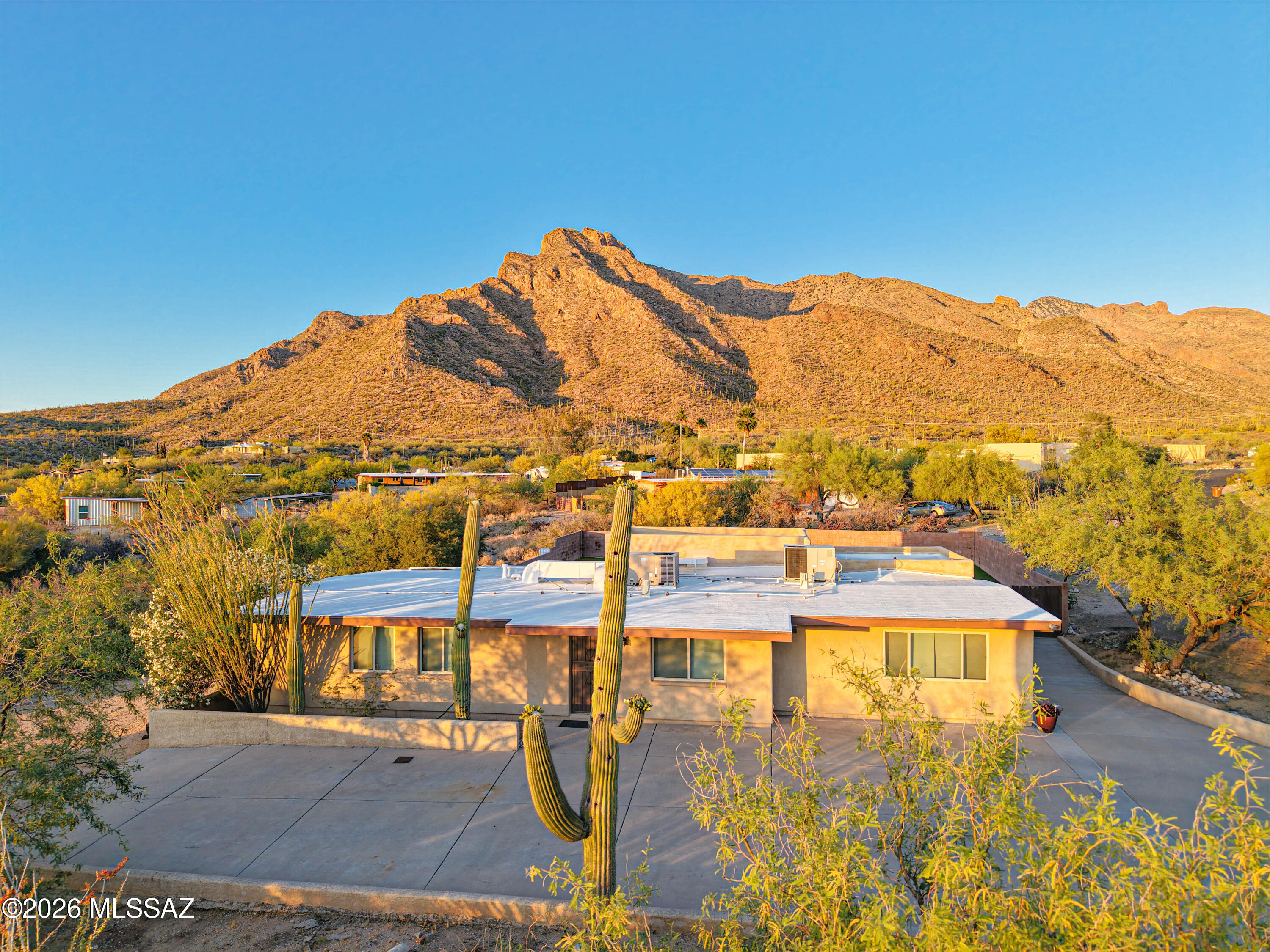 Nestled against the base of the Catalina Mountains, this amazing home in the Rancho Catalina community offers simply gorgeous, up-close views of Pusch Ridge. The views are particularly on display from the private, fenced-in backyard with its refreshing pool & artificial turf areas. Rancho Catalina is a community with NO HOA, larger lots like this one at 0.84 acres, and feels removed from the hustle & bustle, while actually being so close to just about everything in Oro Valley. The interior features travertine floors through much of the home, 4 bedrooms & 3 bathrooms, granite countertops in the kitchen & baths, and an open concept, split bedroom layout. The larger primary suite includes a jetted tub, large shower w/bench, and walk-in closet. This home is a MUST-SEE!