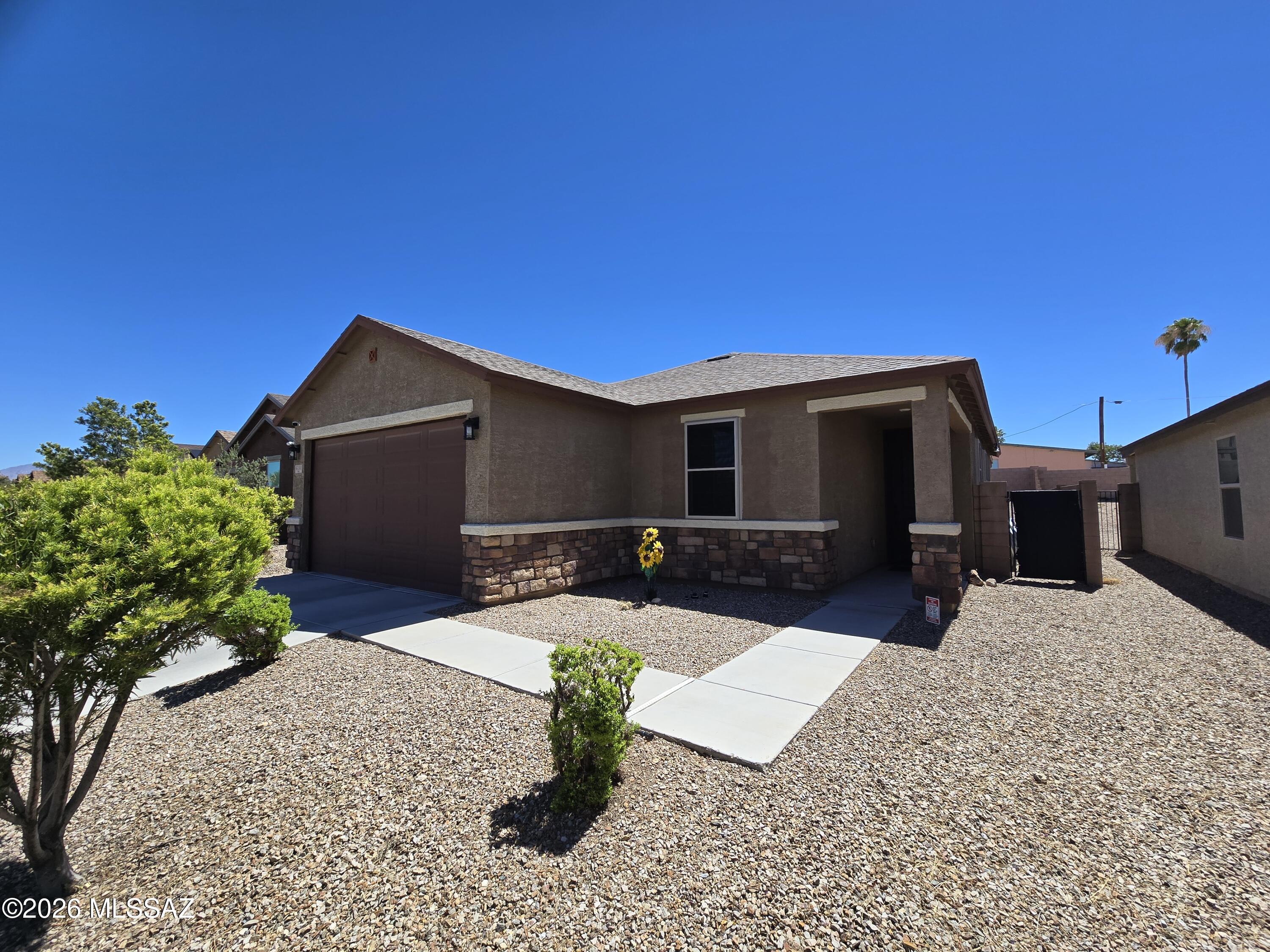 INCREDIBLE 3BR/2BA in quiet, convenient neighborhood could be your new home! Spacious and cool, this house boasts plenty of features that really make it a comfy, cozy home! Enormous great room has plenty of space for both dining and living room fixtures! Beautiful kitchen with island breakfast bar, stone counters and stainless steel appliances! Spacious master suite located just off the great room comes with walk-in closet and dual sinks in the bathroom! Large secondary bedrooms so everyone has plenty of personal space! Huge yard with covered patio perfect for entertaining, or just relaxing on a cool night! 1 dog welcome on approval with deposit, no cats please! DON'T WAIT ON THIS GORGEOUS HOME! SCHEDULE your showing TODAY!!