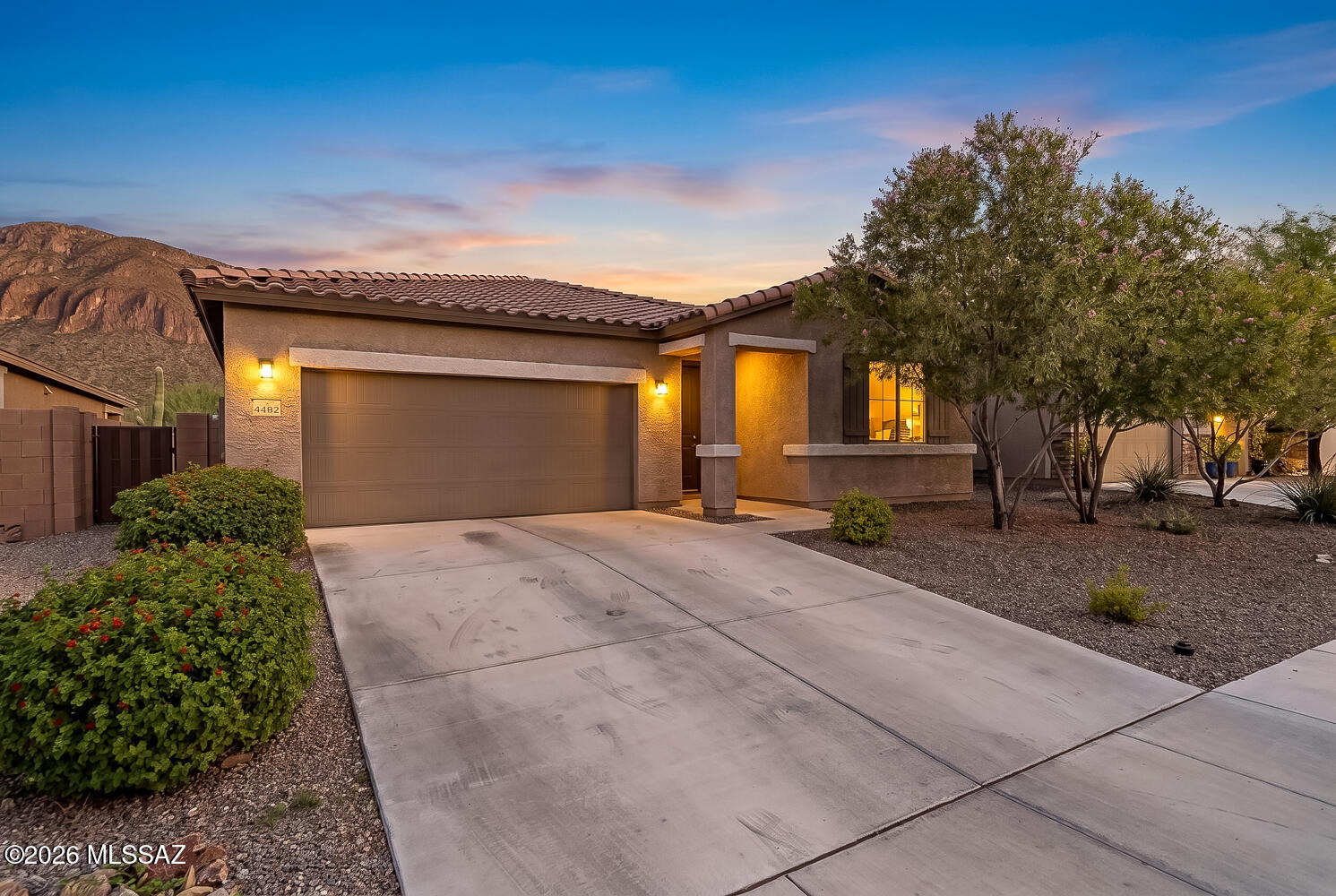 Move-in ready and built in 2020, this beautifully maintained home combines modern comfort with breathtaking mountain views. The open-concept floor plan features a spacious great room that flows seamlessly into the kitchen and dining area, creating the perfect space for everyday living and entertaining. Fresh interior paint in select areas adds to the home's bright, well-cared-for feel, while pride of ownership is evident throughout. Step outside to a covered patio overlooking desert landscaping and enjoy the privacy of having no rear neighbors, with the Tucson Mountains providing a stunning backdrop. Conveniently located near I-19, shopping, dining, parks, and schools, this home offers the ideal blend of comfort, convenience, and low-maintenance living in the desirable Rancho Cascabel community.