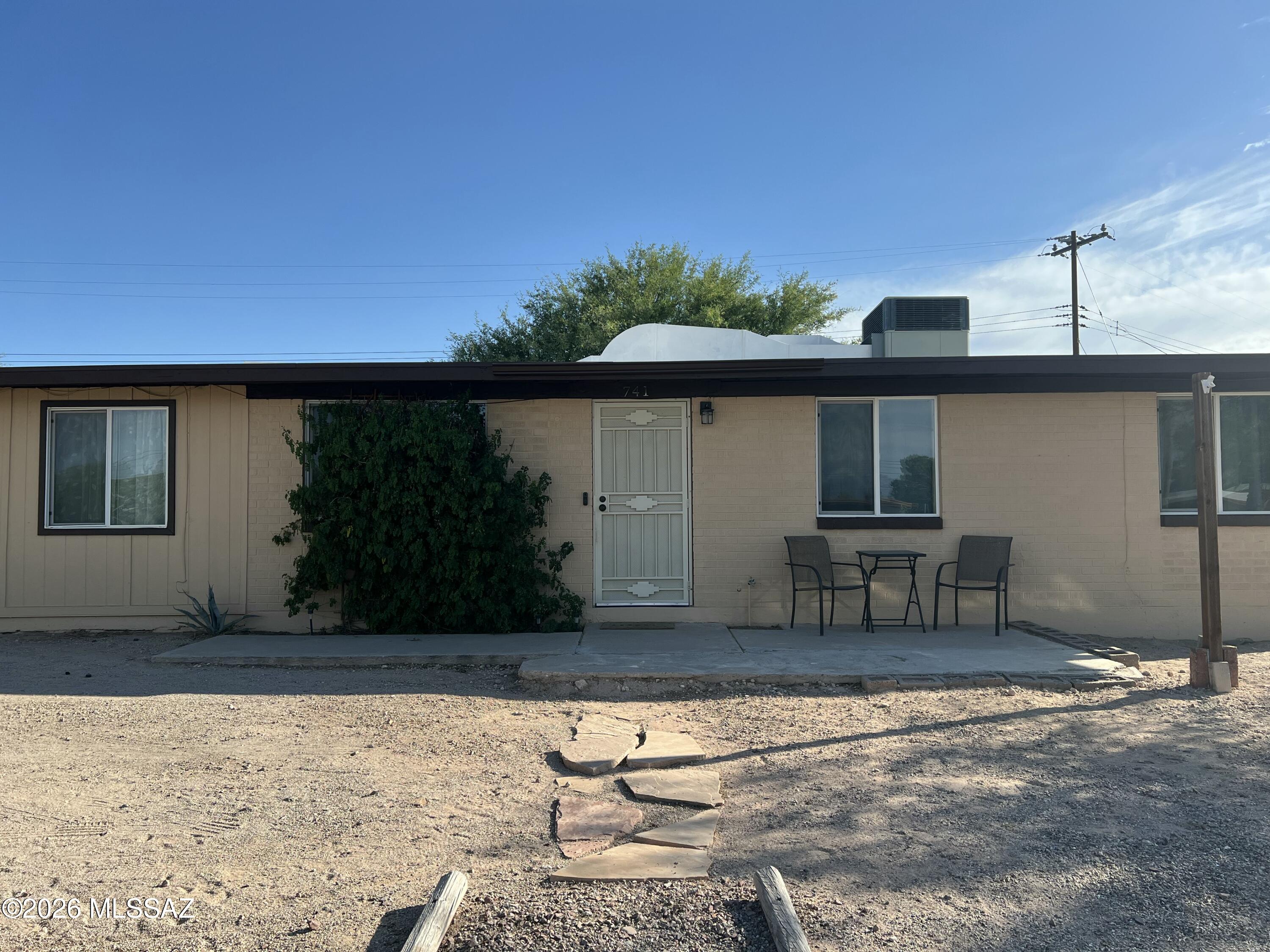 This stunning southwest style home is located in South Tucson with 4 spacious bedrooms and 3 modern bathrooms. The open floor plan makes for a welcoming place to entertain or simply relax. Additional square footage (unpermitted) in converted second master bedroom. Kitchen has an abundance of sturdy, wooden cabinets.  Beautifully landscaped, low maintenance backyard/front yard with a full surrounding fence allowing more privacy and security. Close proximity to I-19 and the Tucson International Airport, making it convenient for travel. Your new home awaits.