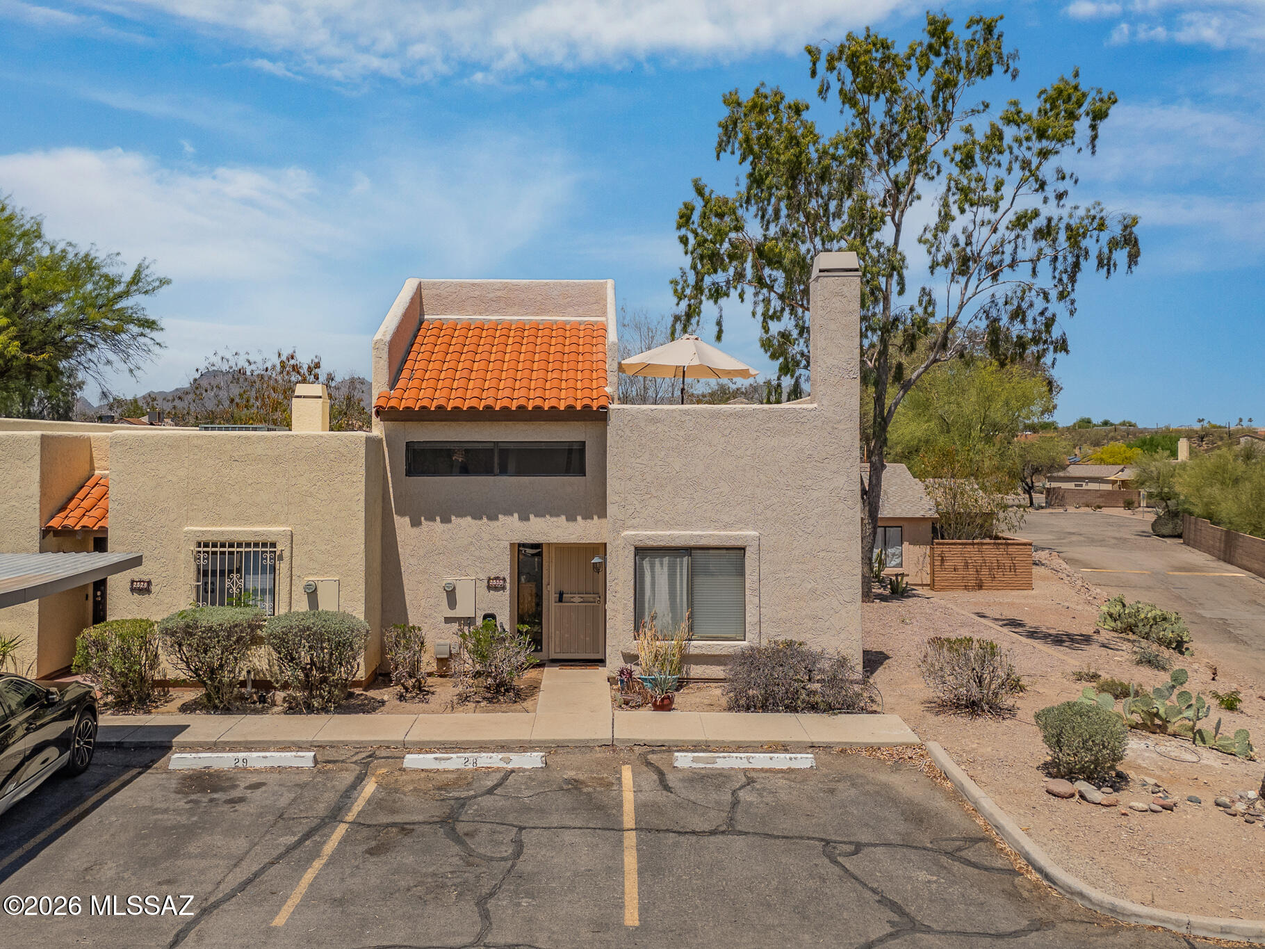 Welcome to this charming end-unit townhome in a desirable gated community! Offering 2 bedrooms, 2 bathrooms, and a versatile den currently used as a third bedroom, this home provides flexible living space to fit your needs. Tucked away at the end of the street with only one shared neighbor, you'll enjoy added privacy and a peaceful setting. Inside, you'll find newer appliances and an updated HVAC system for comfort and peace of mind. The highlight of the property is the rooftop terrace, where you can take in stunning mountain views and Arizona sunsets. Combining privacy, flexibility, and unique outdoor living, this home offers an exceptional opportunity at an attractive price point.