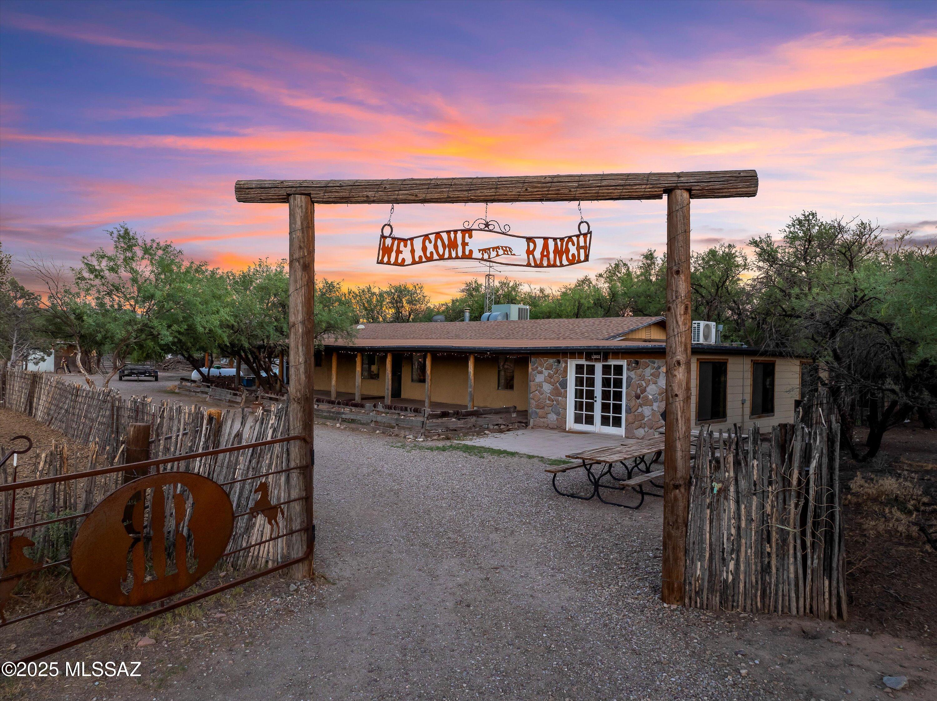 Welcome to The Ranch! This fantastic property was used as a guest ranch and is ready for its new owners. The property comprises three separate parcels totaling 29.96 acres. It features a main home with two bedrooms, two bathrooms, and a large bonus room they use as the dining hall for guests, a second home with two bedrooms and one bathroom, and a bunkhouse. It also has a large tack room, tool shed, bonus room, covered hay barn, chicken coop, a large round pen, smaller round pen, five large turn outs, stalls, arena, three wells (one on each parcel), 4 RV hook ups, owned propane tanks, high grade generator, 10 acres of vacant land with old growth mesquite trees, 360 degree million dollar views, and so much more!
The property is zoned commercial, so it is ready for any business you bring to it! The owner has 9 years left of a 10-year exclusive trail riding lease on the State Trust Land and will transfer the permit to the next owner. This location is about 20 minutes from Benson, less than an hour to Tombstone, an hour and 20 minutes from Bisbee, and about an hour to Tucson!
Whether you want it for a family homestead, a guest ranch, a sanctuary, or to run a livestock operation, you'll enjoy having this property for generations to come.
**The all-inclusive guest ranch was very successful and was rated #1 on TripAdvisor.