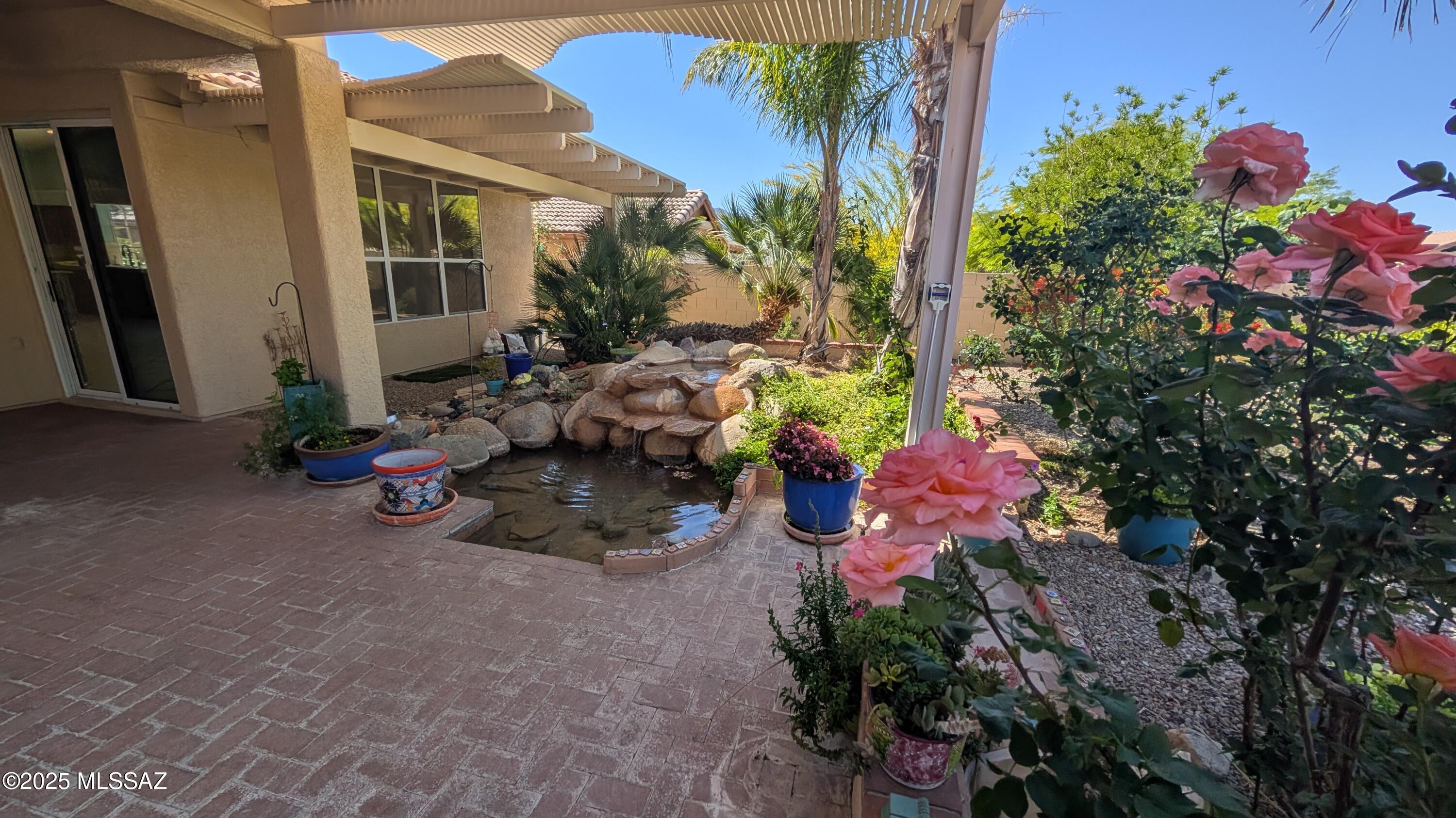 Your SECRET ROSE GARDEN! This is one of those very RARE finds: a Private rear yard OASIS that will draw you outside like nothing you've seen before! This wonderful home has 2-Bedrooms PLUS DEN inside main house, Huge Living Room, Formal Dining Room, Large Great Room off Kitchen with 2-way Fireplace. Upgraded Kitchen with all appliances included. Large Master Suite with big soaking Tub. All the main rooms look out to the rear Garden Paradise- and then you step into the Casita- strategically hidden in the rear yard instead of out front. Big, Bright Casita with its' own view of the lush yard. Owner maintains all the landscape, including special Rose Gardener, so you can enjoy without any effort! Sit out and listen to the water music! Call Listing Broker to see this today!