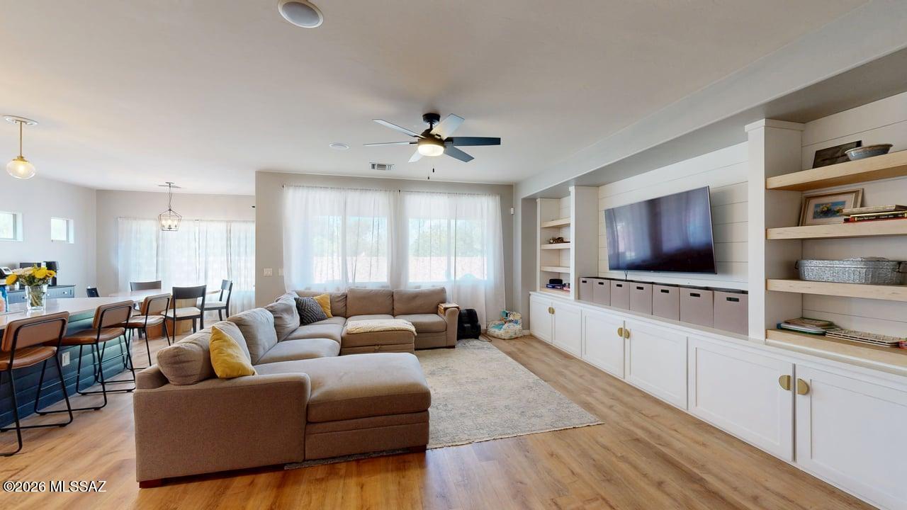 Rare Opportunity! Qualified buyers may be able to assume the seller's VA loan with an exceptional 2.875% interest rate, offering the potential for substantial monthly savings compared to today's market rates.

Welcome to this beautifully maintained home nestled on a quiet cul-de-sac in the highly sought-after Madera Highlands community. Pride of ownership shines throughout this move-in-ready residence featuring a desirable split-bedroom floor plan with 4 spacious bedrooms, 2 full bathrooms, and an oversized 3-car tandem garage.

The heart of the home is the stunning open-concept kitchen, complete with elegant quartz countertops, a large center island, crisp white cabinetry, stainless steel appliances, and stylish gold pendant lighting and hardware that create a sophisticated yet inviting atmosphere--perfect for entertaining or everyday living.

Escape to the beautifully updated primary suite, where the recently remodeled soaking tub and walk-in shower provide a spa-like retreat you'll enjoy every day.

Step outside to your private backyard oasis featuring professionally landscaped grounds, low-maintenance artificial turf, and attractive flagstone--an ideal setting for relaxing, entertaining, or enjoying Arizona's beautiful evenings.

The washer, dryer, and refrigerator are included, making your move even easier.

Residents of Madera Highlands enjoy exceptional community amenities including neighborhood parks, dog parks, walking trails, and a refreshing community pool--all contributing to one of Southern Arizona's most desirable neighborhoods.

Don't overlook one of this home's most valuable features: Qualified buyers may be eligible to assume the seller's existing 2.875% VA loan (subject to lender approval and VA guidelines). VA loan assumptions may be available to both eligible veterans and qualified non-veteran buyers, making this a rare financing opportunity in today's higher interest rate environment.

This is more than just a beautiful home--it's an opportunity to enjoy an exceptional lifestyle while potentially benefiting from one of the lowest mortgage interest rates available. Schedule your private showing today!
