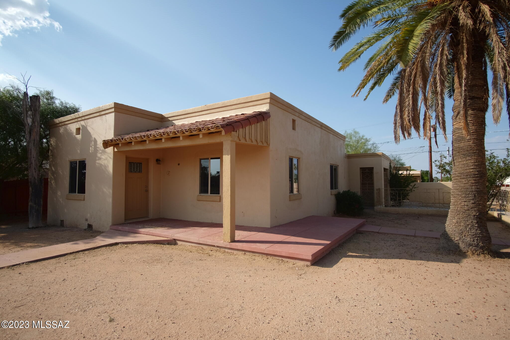 Text for walkthrough video/more info. Remodeled South Tucson 2 Bedroom/1.5 Bath on a corner lot with Air Conditioning, 1168sf, granite counters, cherry cabinets, cathedral ceilings, vinyl plank flooring, carport, washer + dryer, and gated/walled yard. Rent INCLUDES WATER/SEWER/TRASH AND ELECTRIC- Tenant pays Gas only. 12mo minimum Lease, Costs are: Non-refundable $50/adult Application, $1395 Security Deposit, $150/pet with approved pet, $350 cleaning. Available immediately