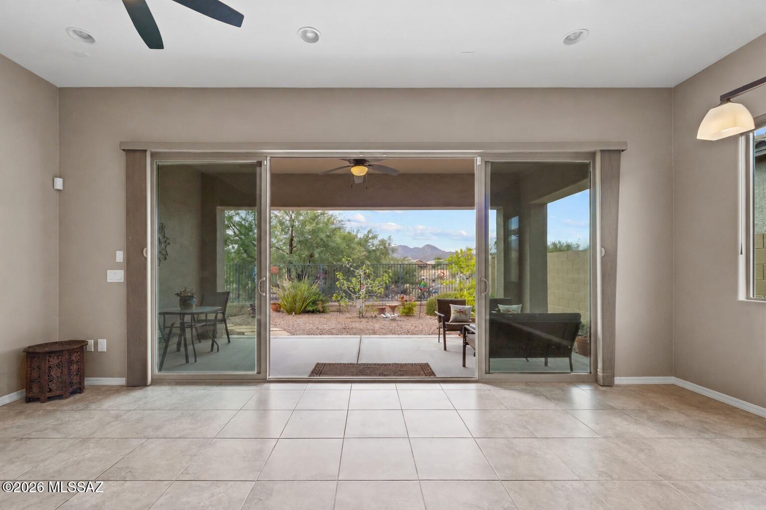 Better Than New in Oro Valley with Resort-Style Living at Its Finest! Welcome to this beautiful 2017 built single-story home located in the Gated community of Center Pointe Vistoso, one of Oro Valley's most sought-after neighborhoods. Priced below Appraised value! This 2,020 sq. ft. residence offers 3 bedrooms, 3 bathrooms, and a LARGE den/flex room that could easily serve as a 4th bedroom, home office, or media room.     Designed for both comfort and entertaining, the home features a gourmet kitchen with a large island, granite countertops, upgraded cabinetry, designer backsplash, gas cooktop. Additional upgrades include an expansive 16-foot sliding glass door, a coffered foyer ceiling, two-tone interior paint, and a luxurious Oversized/extended primary bedroom with a large walk-in shower and oversized L spahed closet! The backyard backs to natural desert open space, providing privacy, mountain views, and a peaceful Arizona setting and covered patio for outdoor living space. Brand new carpet in guest bedrooms!  Apple and fig and citrus trees in backyard.     Walking distance to the Resort style Clubhouse, offering amenities not found anywhere else in NW Tucson! A stunning 6,000-square-foot clubhouse with a large, 25-meter long and oversized massive resort-style pool, in-ground spa, splash pad, private event room with indoor and outdoor kitchen and BBQ area, fireplace lounge, shaded ramadas, picnic areas, playgrounds, parks, and walking trails.        Outdoor enthusiasts will love the direct access to the 6.2-mile paved Vistoso Trail, as well as nearby connections to The Loop, the 135-mile walking or biking trail system. Residents also enjoy access to nine additional parks throughout Rancho Vistoso, creating endless opportunities for recreation and outdoor enjoyment.        Conveniently located near Golf courses, shopping, dining, schools, Oro Valley Hospital, Catalina State Park, Big Wash Trailhead, Hone Bee Canyon, and Oro Valley Marketplace, this home offers the perfect combination of luxury, convenience, and an active lifestyle.        If you've been searching for a newer home with mountain views, privacy, and resort-style community amenities that are virtually unmatched in NW Tucson, this is a rare opportunity you won't want to miss.