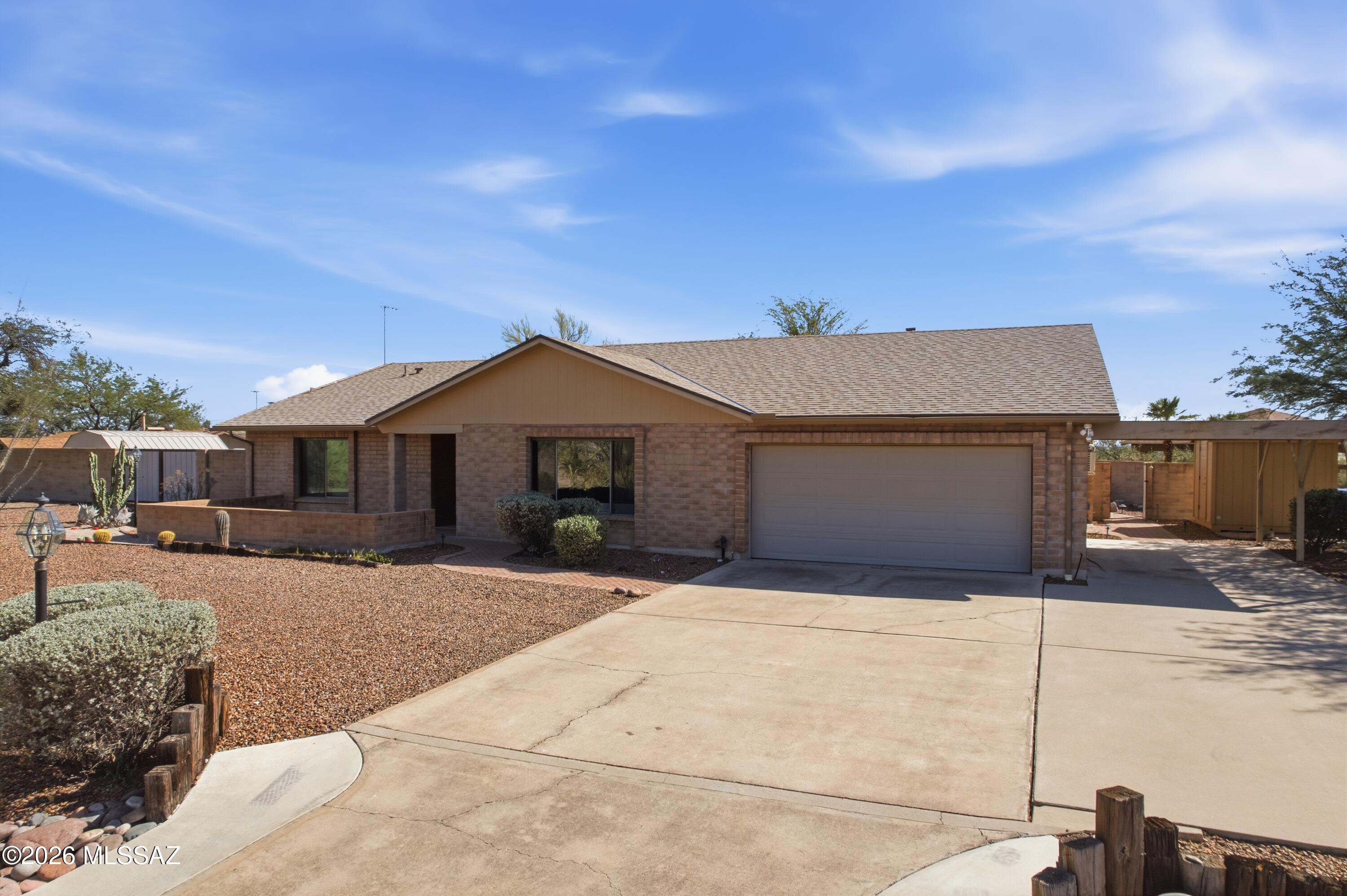 You will love this single-story remodeled home on over a half acre with NO HOA! Superb location w/mountain views, covered patio with pavers, big .63 acre lot. An OWNED Solar System helps keep low electric bills. BRAND NEW A/C unit just installed in May 2026. Now for the upgrades... updated kitchen including all new appliances and counter tops, huge pantry with fridge and more room that you can need. Primary suite w/ dual sinks, shower and tub. Family room with vaulted ceilings and wood burning fireplace. Exterior has THREE storage sheds, benches in backyard and room for everything you need. Full size garage with SHOP area in the back, storage cabinets and attached carport gives you plenty of parking options. Perfect house for someone with business, tools or hobby that needs space!