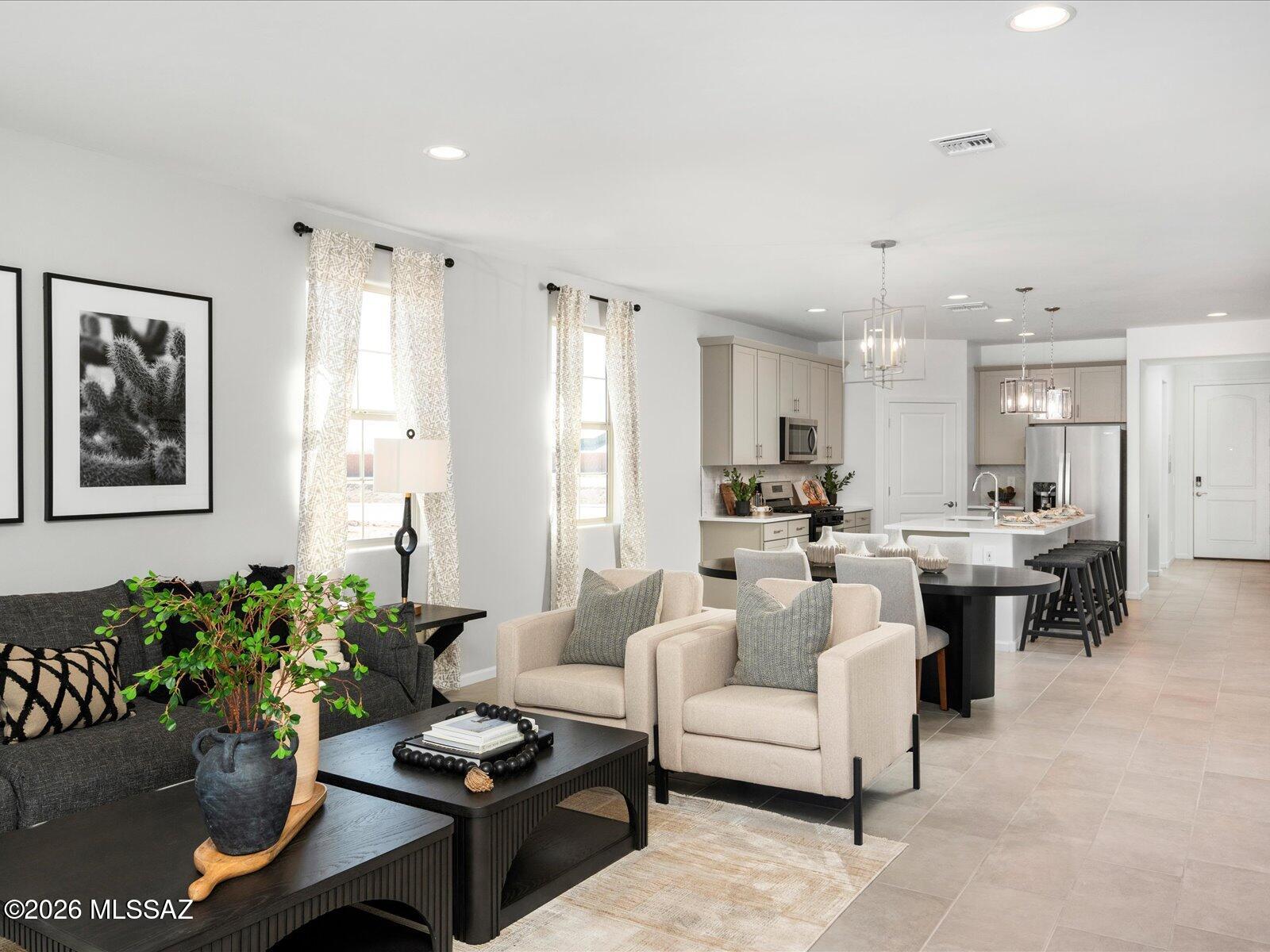 4 bedrooms and 3 bathrooms, plus a versatile teen room that's perfect for homework, TV, or gaming. The primary suite features dual sinks and a spacious walk-in closet.
Mandarina is now selling in Marana, AZ--this master-planned community offers amenities such as a swimming pool, pickleball courts, playgrounds, a dog park, and more. The home is move-in ready and includes a washer, dryer, refrigerator, and whole-home blinds.
Each home is built with innovative, energy-efficient features designed to provide savings, improved comfort, better health, and peace of mind.