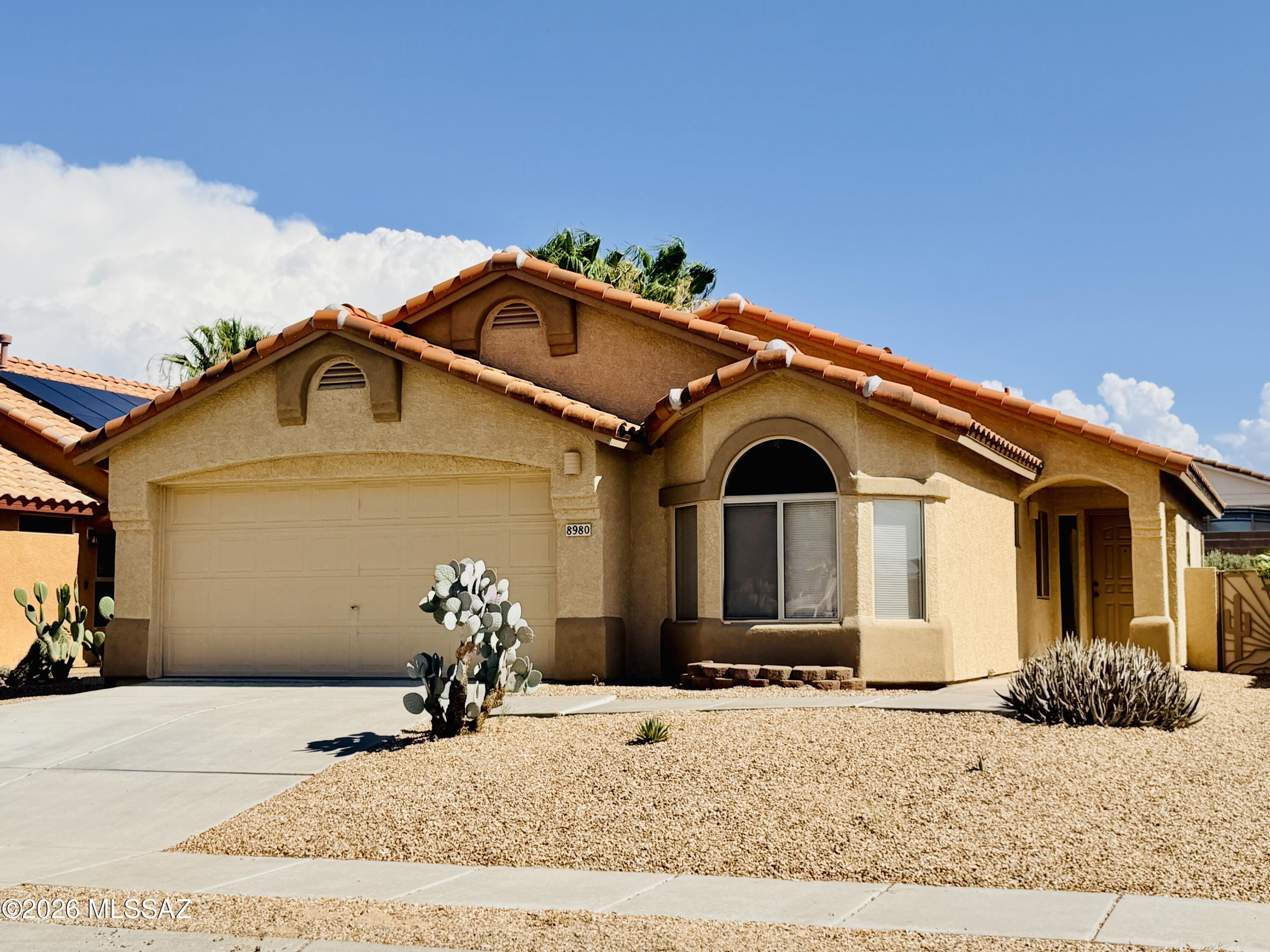 *See video tour in Photos section* Located in Rita Ranch community on Tucson's East Side, this charming home features a split-bedroom floor plan ideal for privacy and functionality. Enjoy tile flooring throughout with carpet in the bedrooms, and high ceilings that bring in plenty of natural light, creating an open and airy feel. The home offers a spacious great room, open concept kitchen overlooking living room area with an island - perfect for entertaining while enjoying time in the kitchen. A large backyard with a covered patio and south facing allows for beautiful daylight throughout the day.