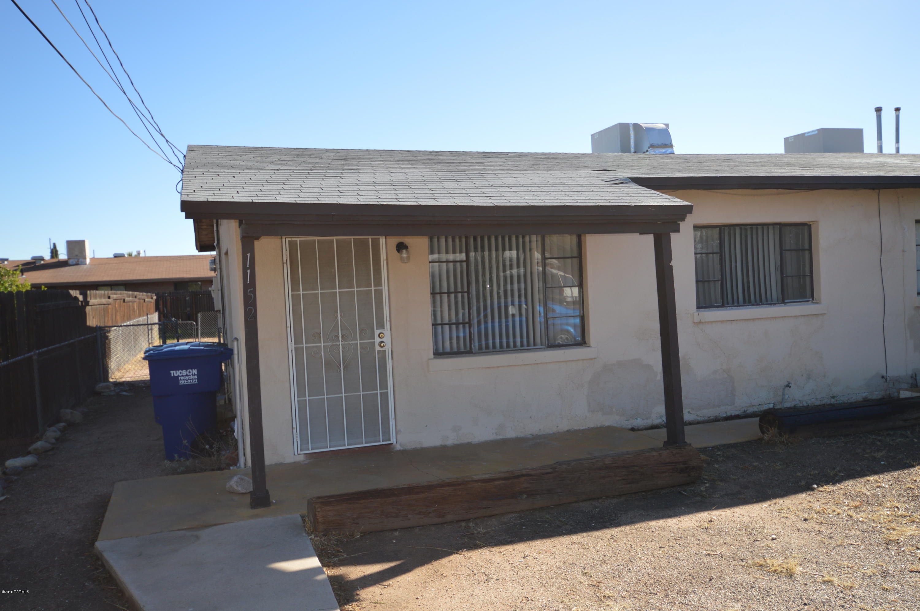 Immaculate unit, solid masonry construction. HUGE, fenced yard with covered patio. Large bedrooms. Big open kitchen with dining area. Central gas heat and hot water. Separate laundry room. Economical, affordable and close to everything, just off Speedway at Rosemont. Don't let this one get by...CALL NOW!!