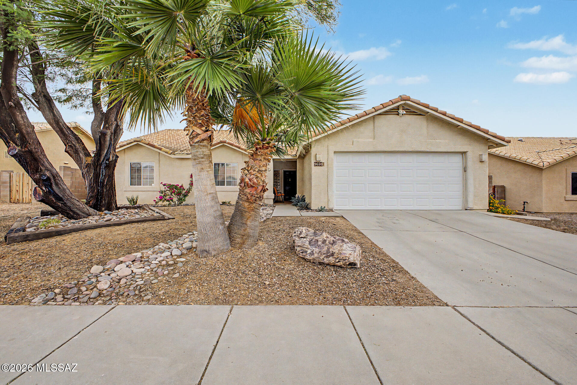 Welcome to your new home! This spacious 4-bed, 2-bath has an open & flexible layout, plus a new AC for peace of mind. The kitchen opens into a large living and dining space, plus you have separate formal living and dining rooms if you want a little extra space to spread out.  The primary bedroom offers a great layout, with a spacious walk-in closet and the additional bedrooms are well-sized with one featuring a charming loft area. 

The large, covered patio is perfect for entertaining, plus you're in the highly rated Vail School District and just minutes from Purple Heart Park, along with nearby shopping and dining.